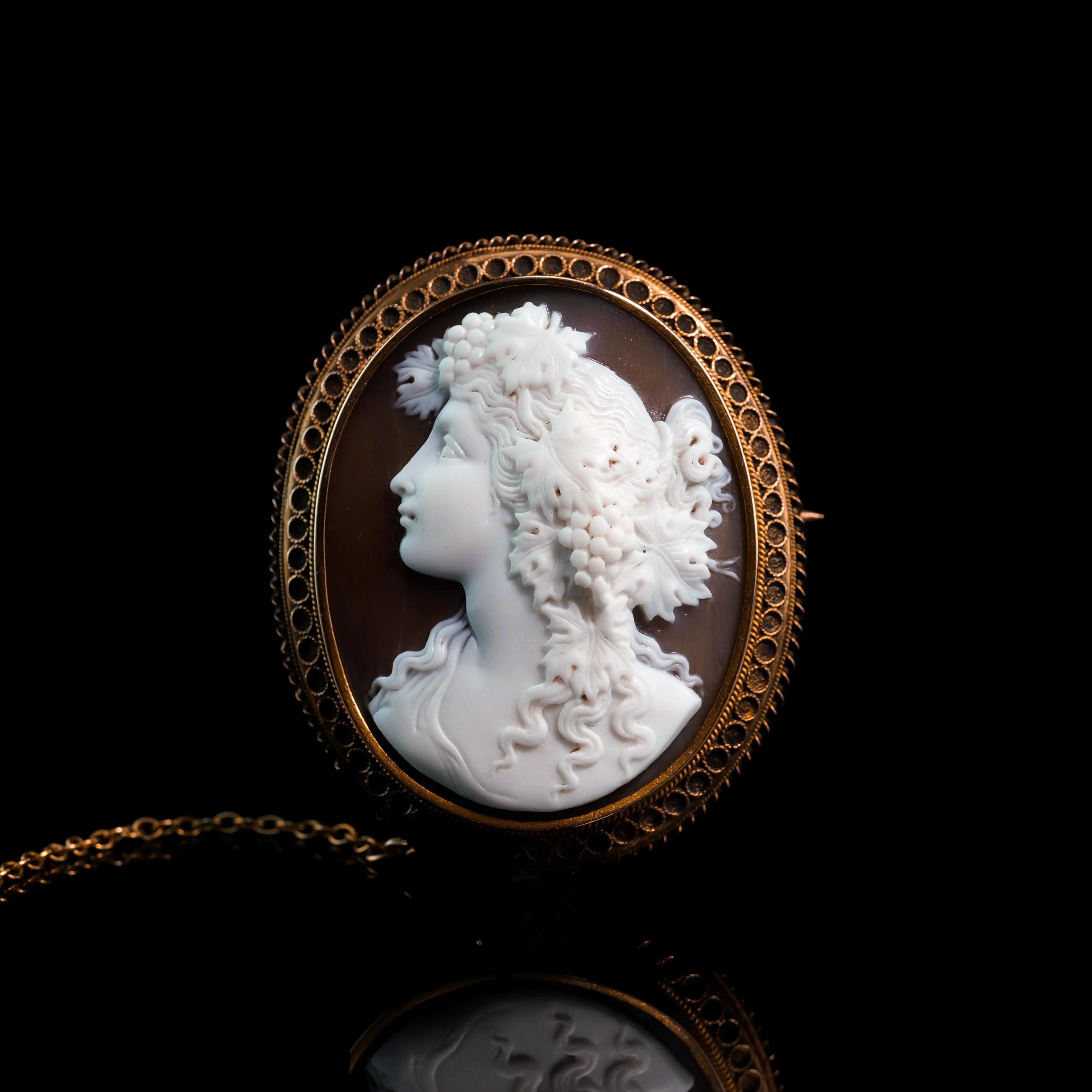 We are delighted to offer this magnificent 18ct gold Victorian shell cameo made c.1860. 
  
The cameo features an intricate and elegant hand-engraved figural head of a Maenad/Bacchante (female followers of Bacchus).
 
The facial expression,