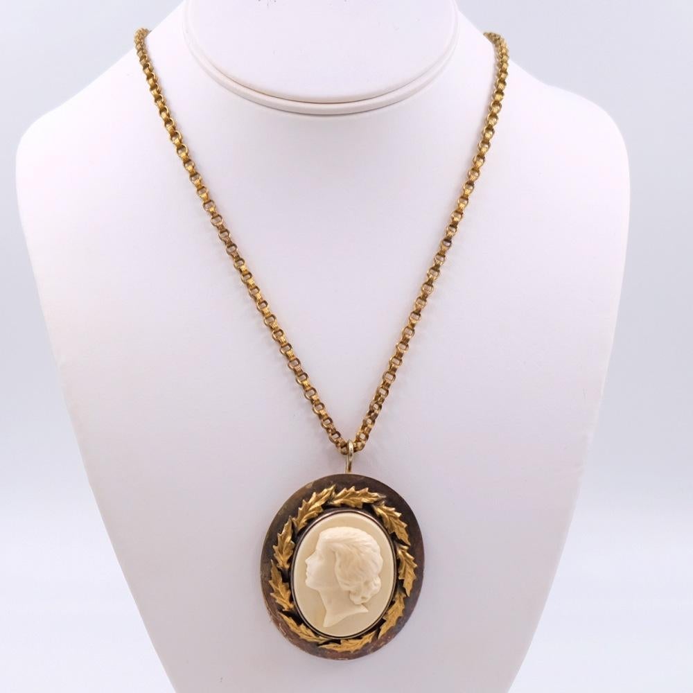 This beautiful cameo necklace can be styled together with a chain or separately as an independent brooch. Very elegant lines of a woman's face decorated with gold-tone metal yellow leaves.
Materials: Base metal, plastic
Dimensions: Chain L 12.6 in,