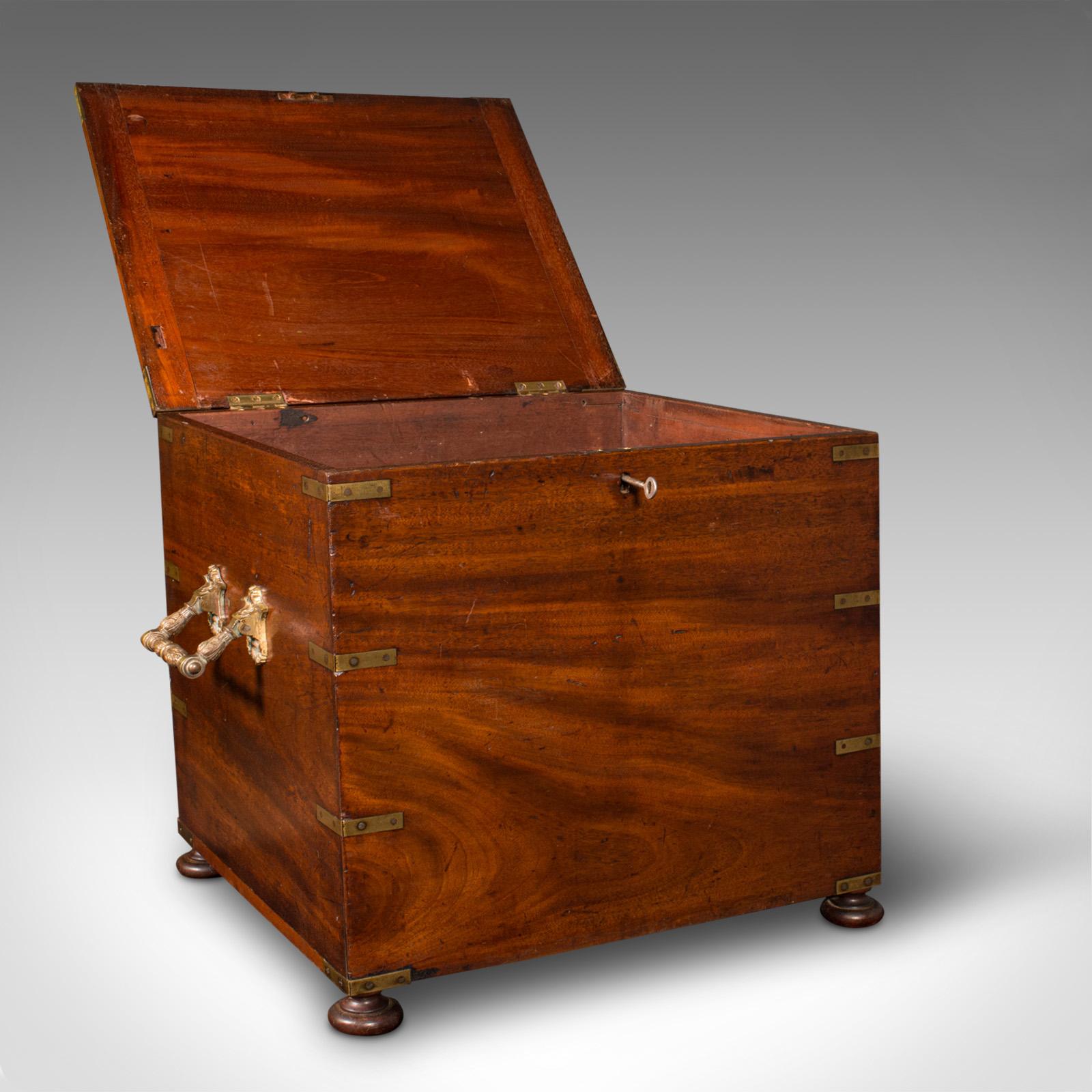This is an antique campaign cellarette. An English, mahogany and brass colonial storage box, dating to the mid Victorian period, circa 1850.

Impressive proportion and of a quality finish and appearance
Displays a desirable aged patina and in good