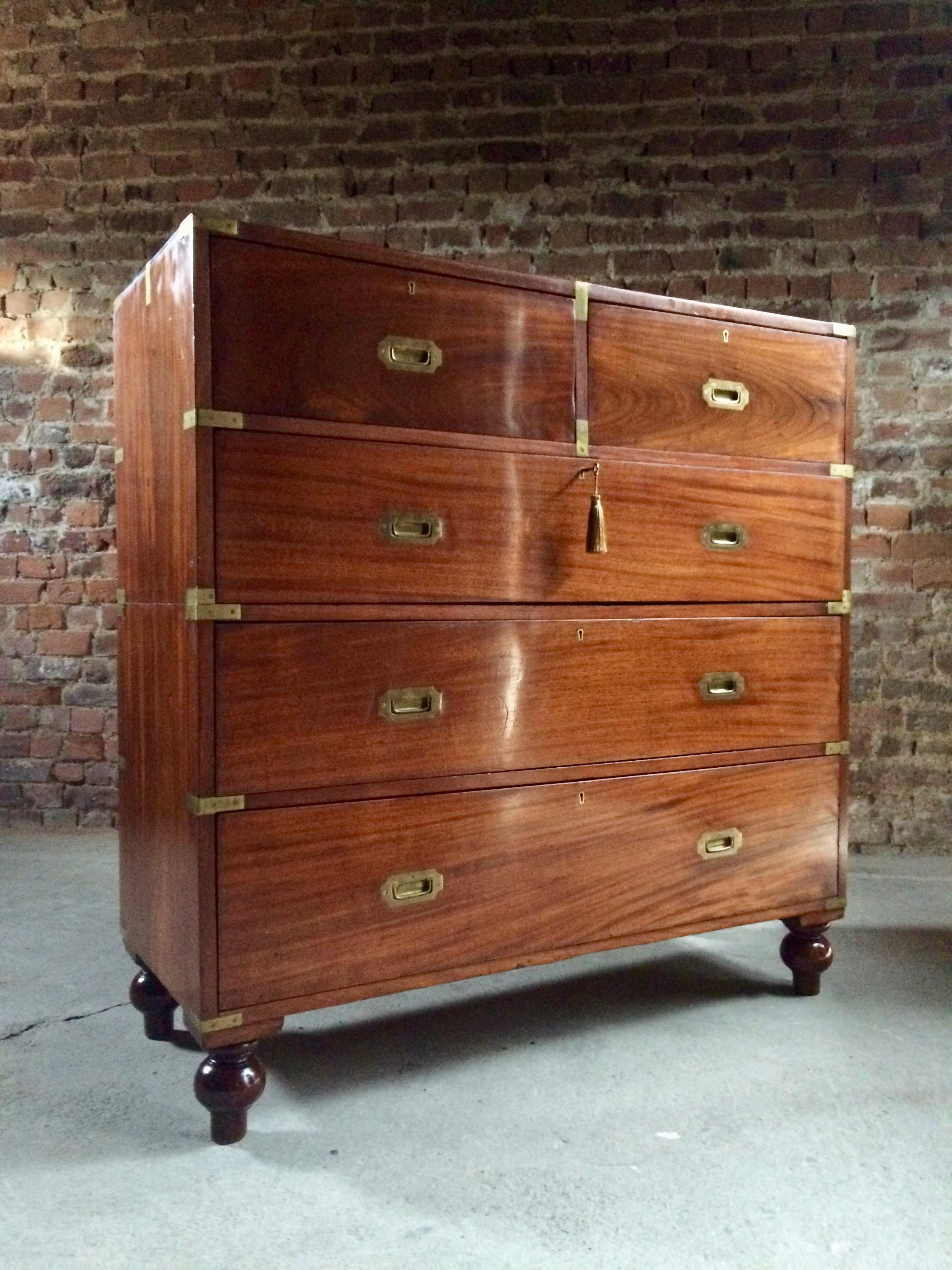 Antique Campaign chest of drawers dresser mahogany tall military Victorian no. 3.

A magnificent tall and impressive antique 19th century mahogany brass-mounted campaign chest of drawers, the rectangular top complete with brass corner protectors