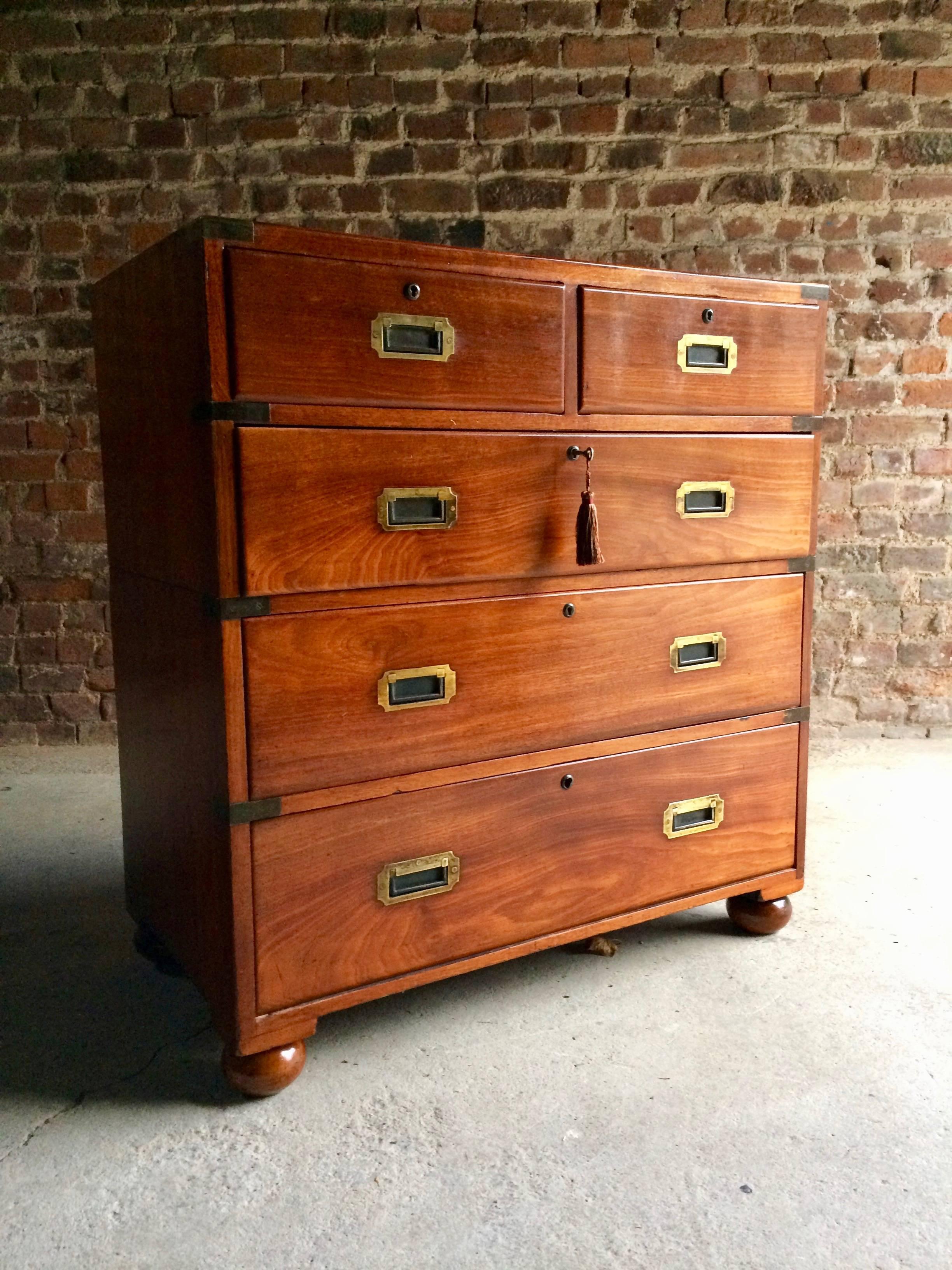 A magnificent and authentic antique 19th century teak brass-mounted campaign chest of drawers, the rectangular top complete with brass corner protectors over two short and three longer graduated drawers, all fitted with campaign brass recessed