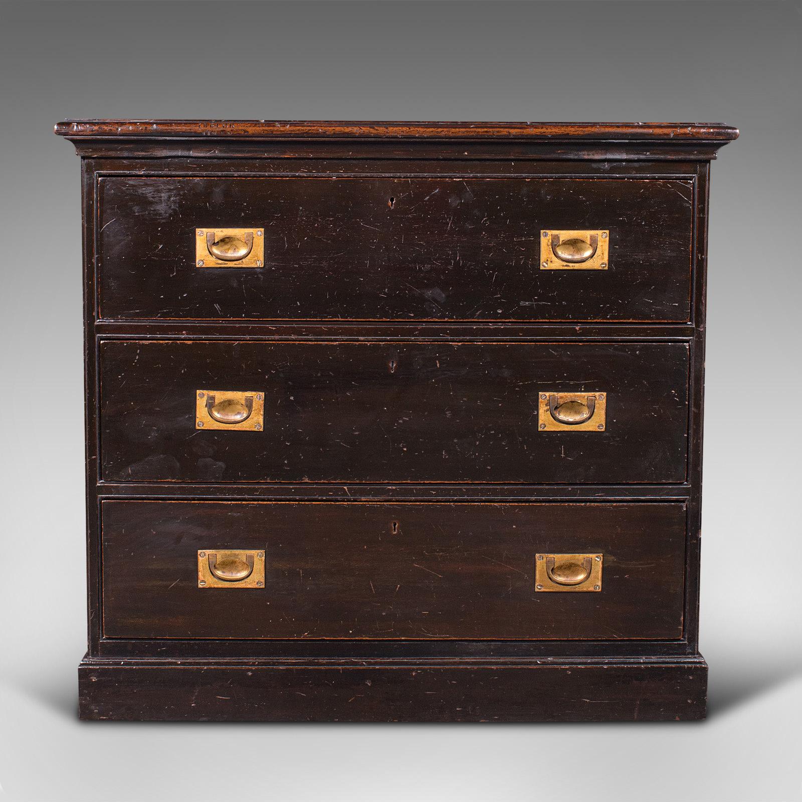 This is an antique campaign chest of drawers. An English, teak lowboy with brass handles, dating to the Victorian period, circa 1880.

Delightfully functional and craftsmanship to stand the test of time
Displays a desirable aged patina