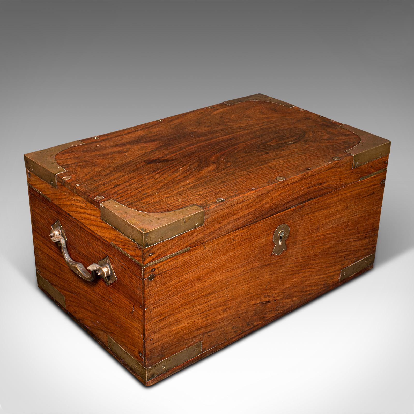 This is an antique Campaign correspondence box. An Anglo-Indian, teak and brass bound Colonial traveller's writing case, dating to the late Victorian period, circa 1880.

Captivatingly appointed interior, set within a quality bound case
Displays