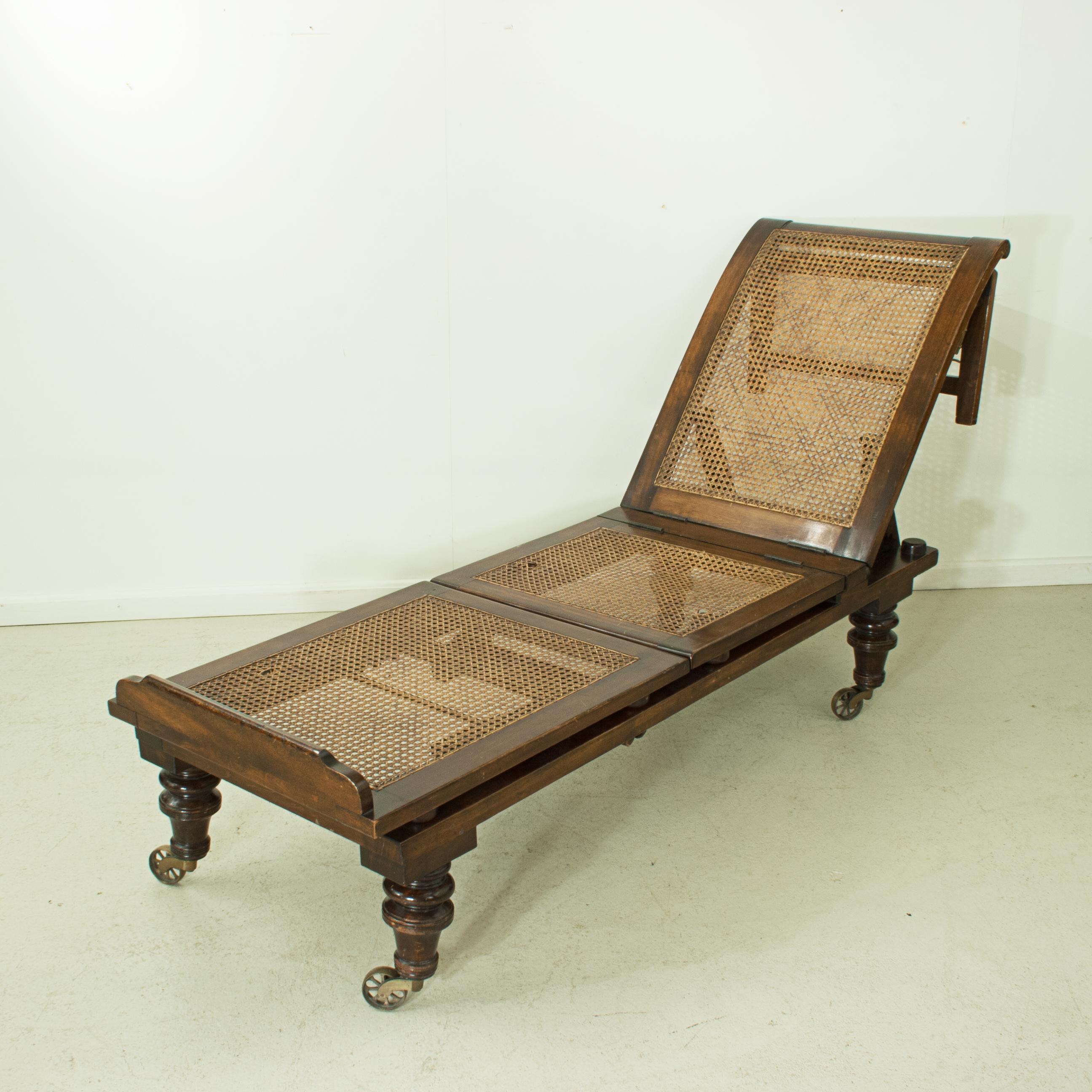 Late Victorian Carter's Patent reclining day bed.
A fully adjustable Alfred Carter campaign or day bed with three cane rattan sections. The three sections can be adjusted into many different positions to suit the comfort of the user, it can also be