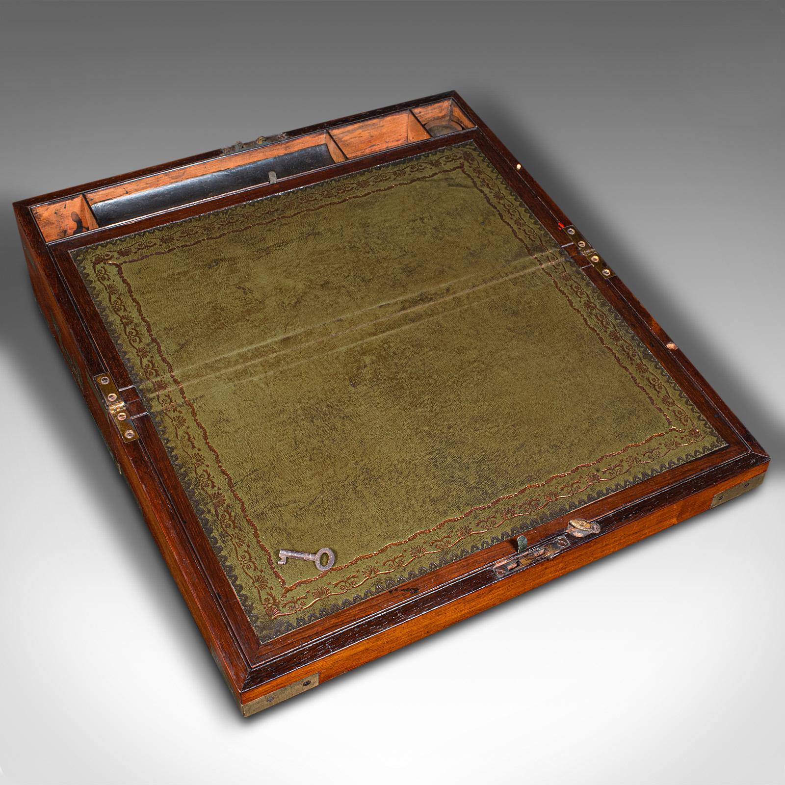 This is an antique military campaign writing slope. An English, walnut and leather correspondence box, dating to the early Victorian period, circa 1850.

Finely crafted writing slope, used in period when away from home
Displaying a desirable aged