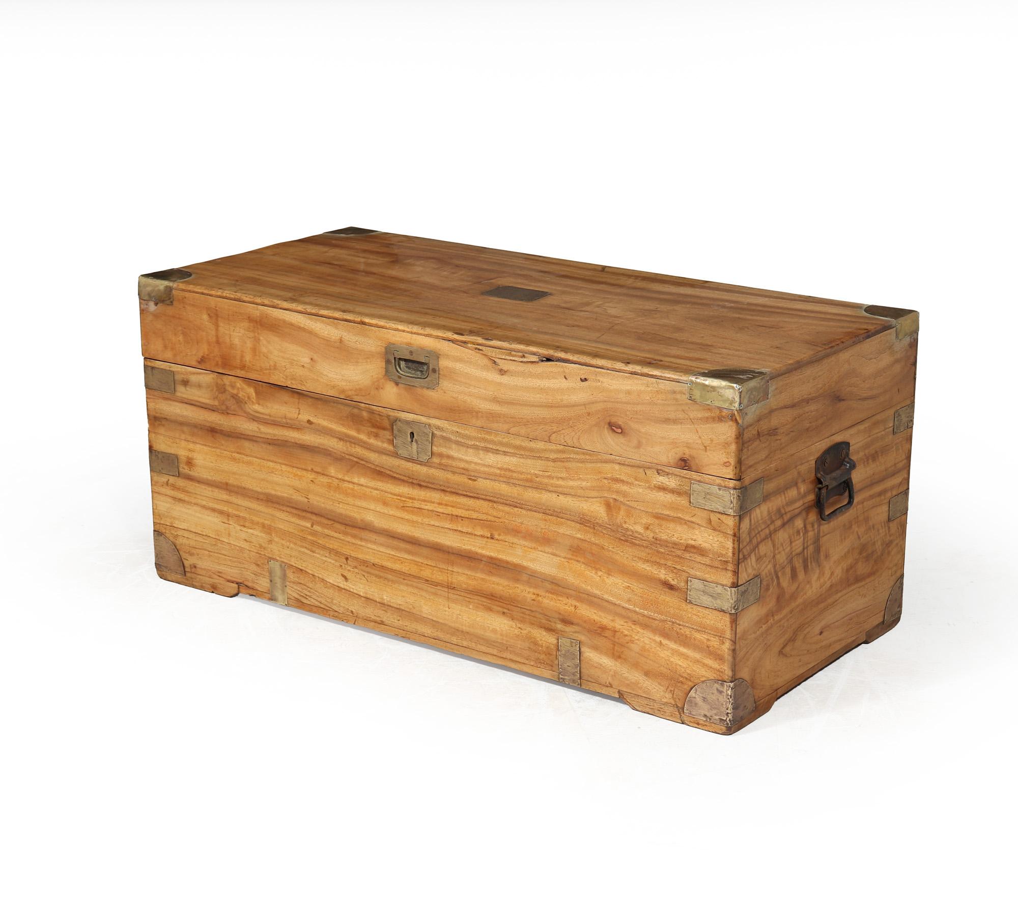 Antique Camphor Wood Box 

The camphor wood box from the late 1890s not only serves as a timeless storage solution but also carries a unique charm that sets it apart from modern alternatives. The marriage of elegant brass fittings with sturdy