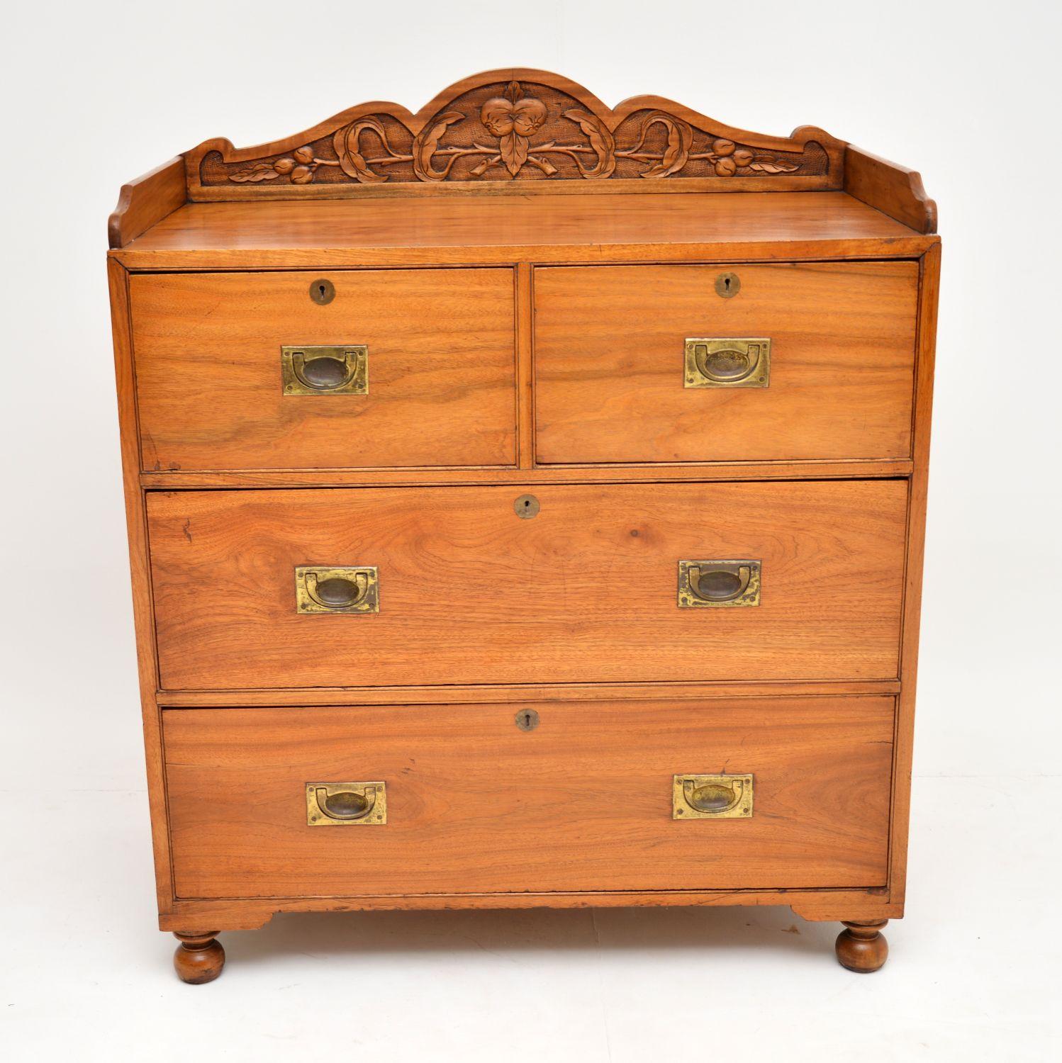 Antique Colonial Camphor wood chest of drawers in excellent original condition, with a carved back gallery & side pieces.

It’s solid camphor wood with a wonderful colour & figuring to the wood. The proportions are quite small & all the drawers