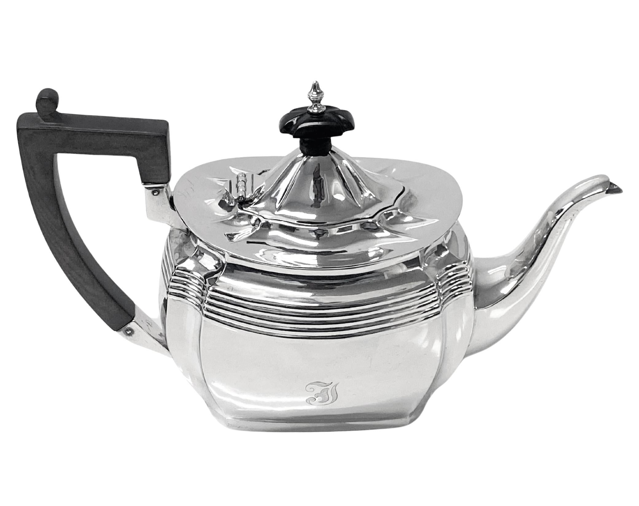 Antique Canadian Sterling silver Teapot Toronto C.1900 Roden Bros. The teapot of plain ribbed design oval rounded form, collet style base. The upper body of the teapot is ribbed with horizontal bands. The shaped waisted shoulders of the teapot