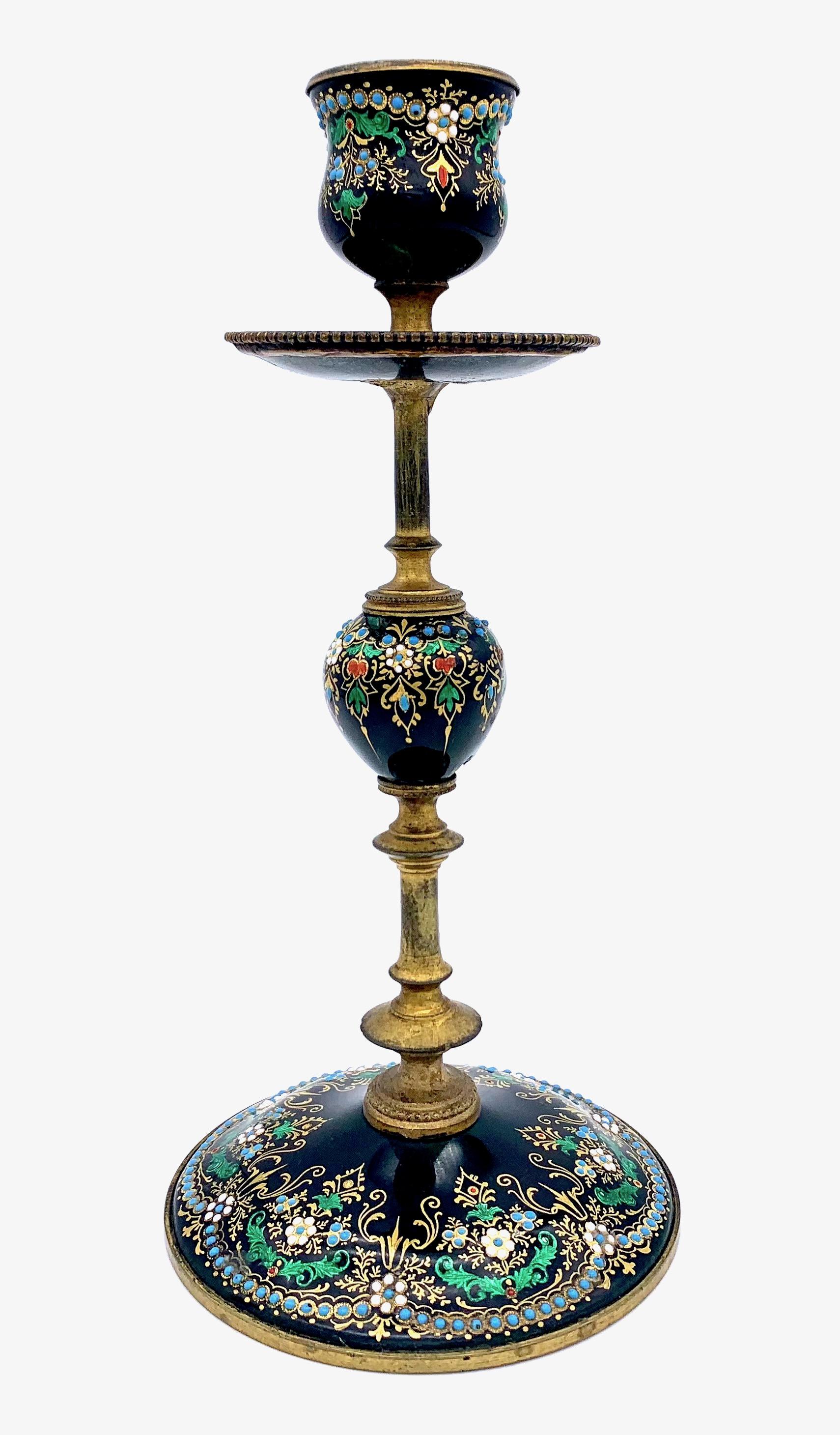 This beautifully enamelled set comprising an inkwell and two candlesticks will cheer up any room.
A fine example of the wonderful enamel work executed in Bresse around 1870.
The mastery of fine enamelling has along tradition in Bourg - en - Bresse