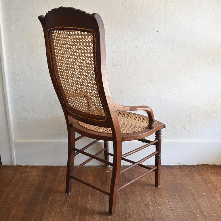 Antique Cane and Carved Wood Arm Side Chair with Rose Detail In Good Condition For Sale In Oklahoma City, OK
