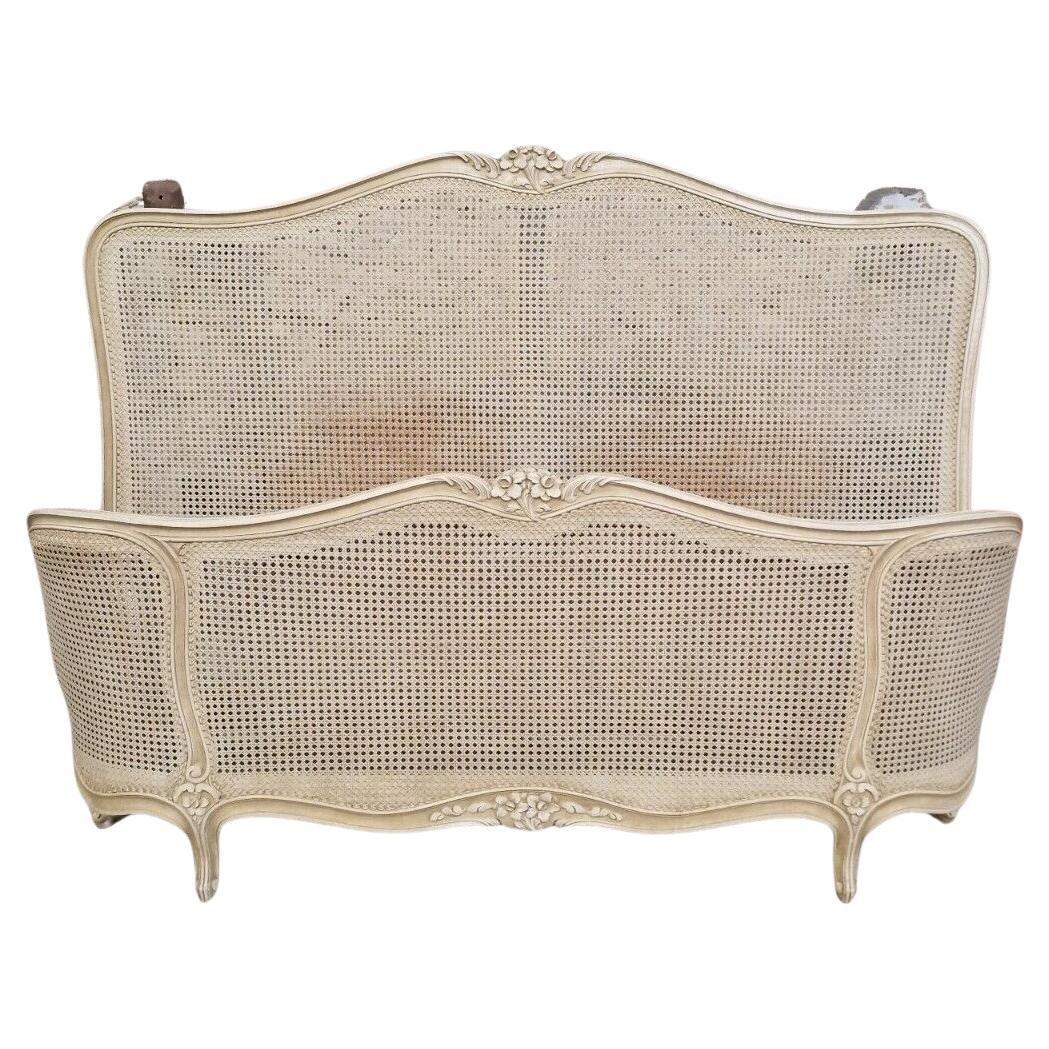 We sourced this Fabulous Cane Bed from Marseille in the South of France.

Cane Headboard & Footboard in Good Condition, the bed is lacquered in cream crackle paintwork, there are lovely Floral Carvings to the headboard and footboard. There are 2