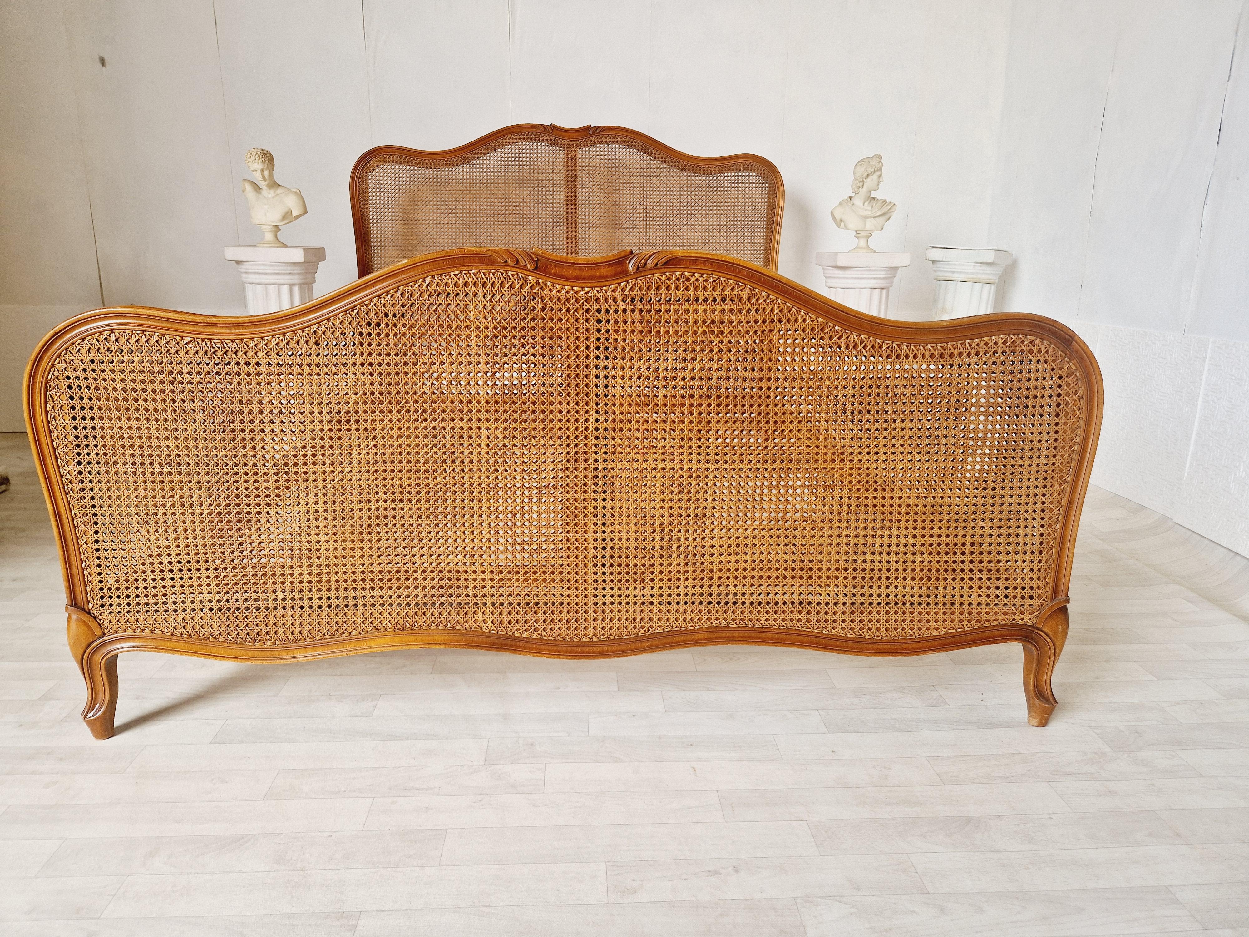 We are delighted to offer for sale this Cane French Bed.

This exquisite antique bed will transport you back in time to the elegance of 1920s France. Crafted in the Louis XV style, this Rocaille bed features delicate carvings and a fabulous wood