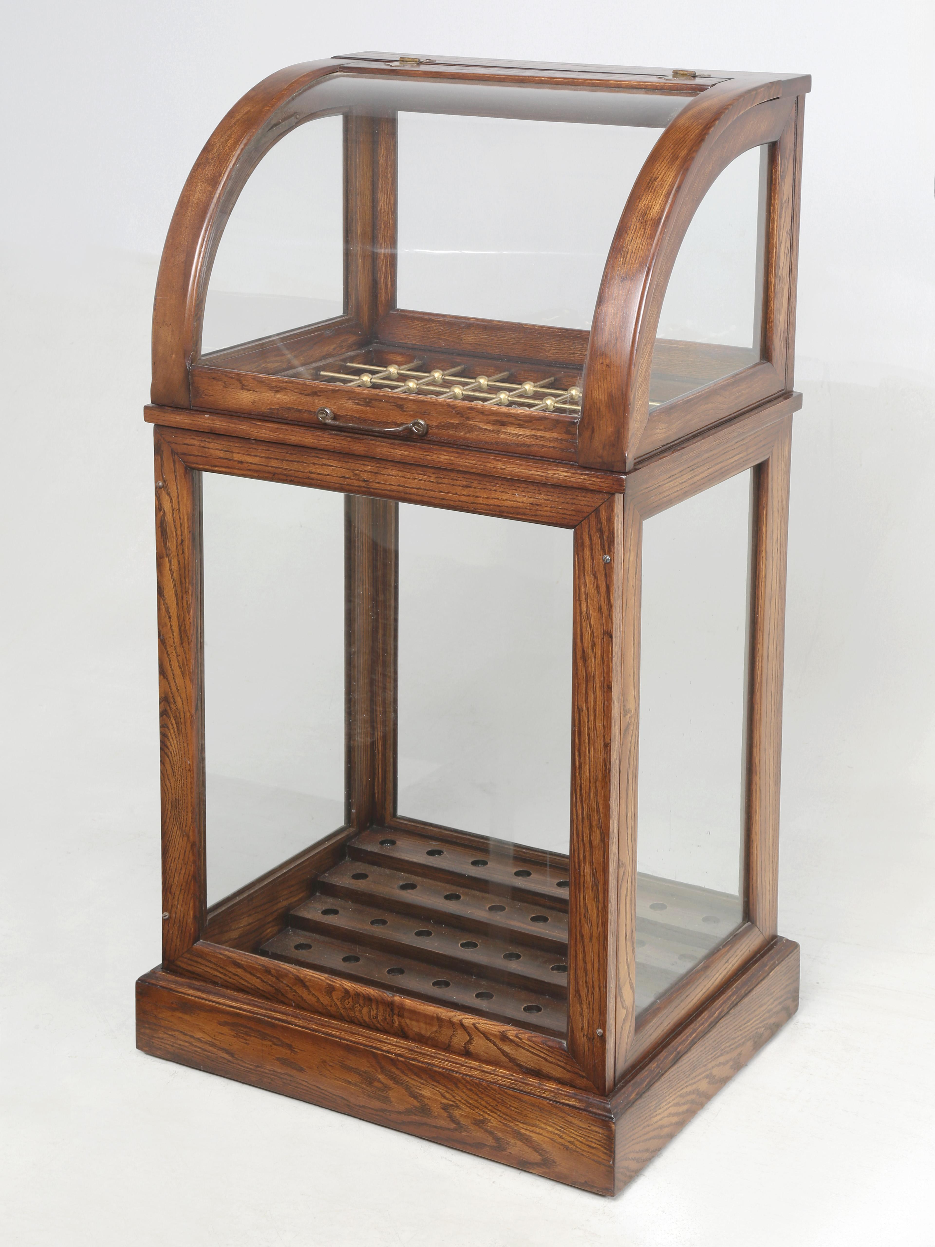 Antique Cane or Umbrella Display Cabinet from a Commercial Department Store Fully Restored and capable of holding 48-Canes, Walking Sticks or Umbrella's. The bottom of the Cane Cabinet was designed in gradual steps to adjust for different length