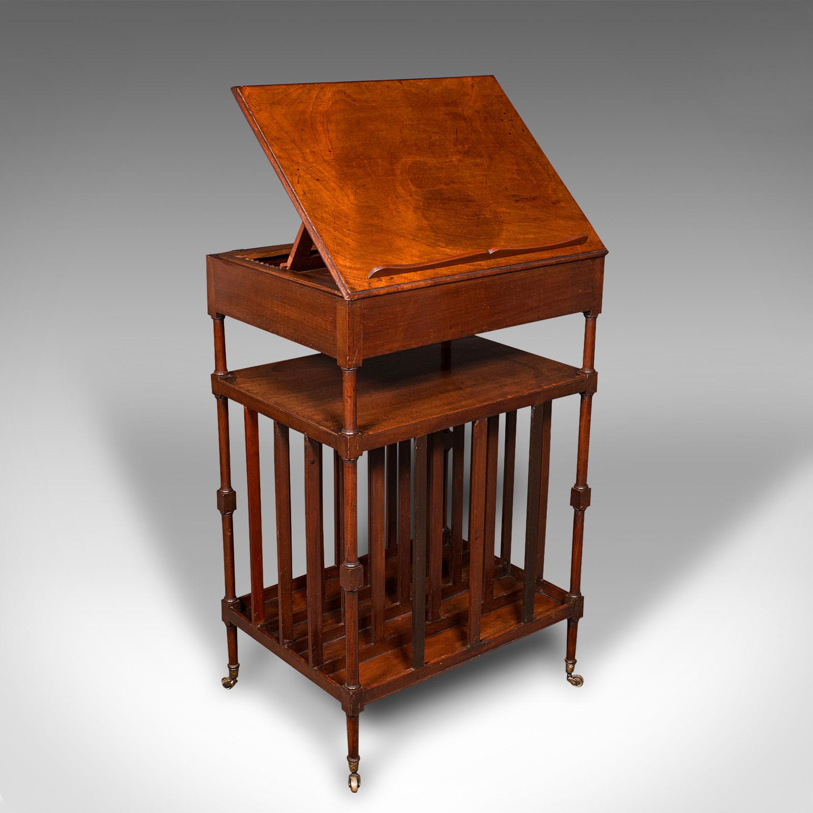 This is an antique articulated reading table. An English, walnut Canterbury lectern with riser, dating to the Regency period, circa 1820.

Articulates through several positions, with useful storage below
Displays a desirable aged patina and in