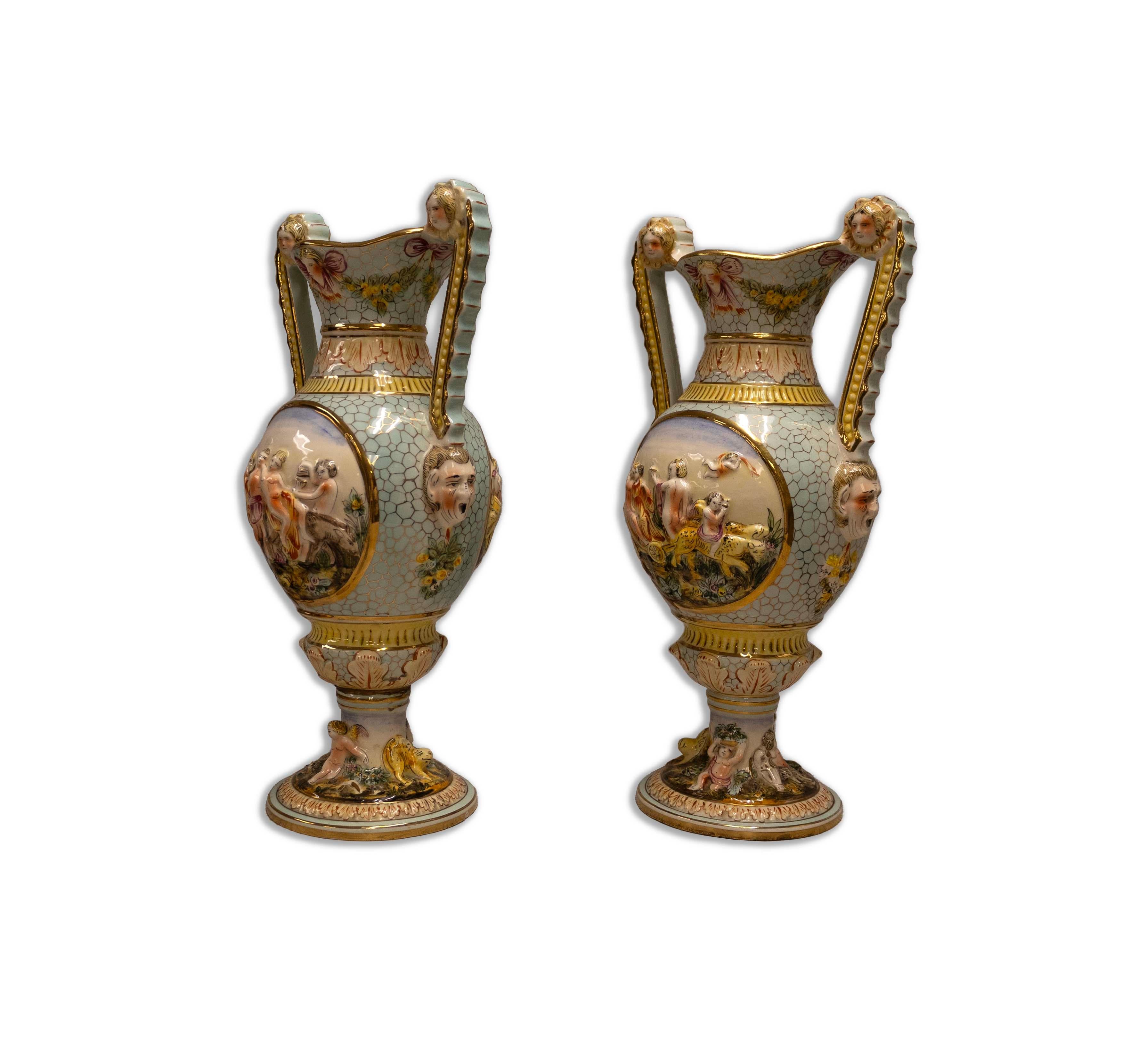 Immerse yourself in the opulence and artistry of these majestic ornate sculptural vessels designed by Capodimonte. Stamped on bottom 