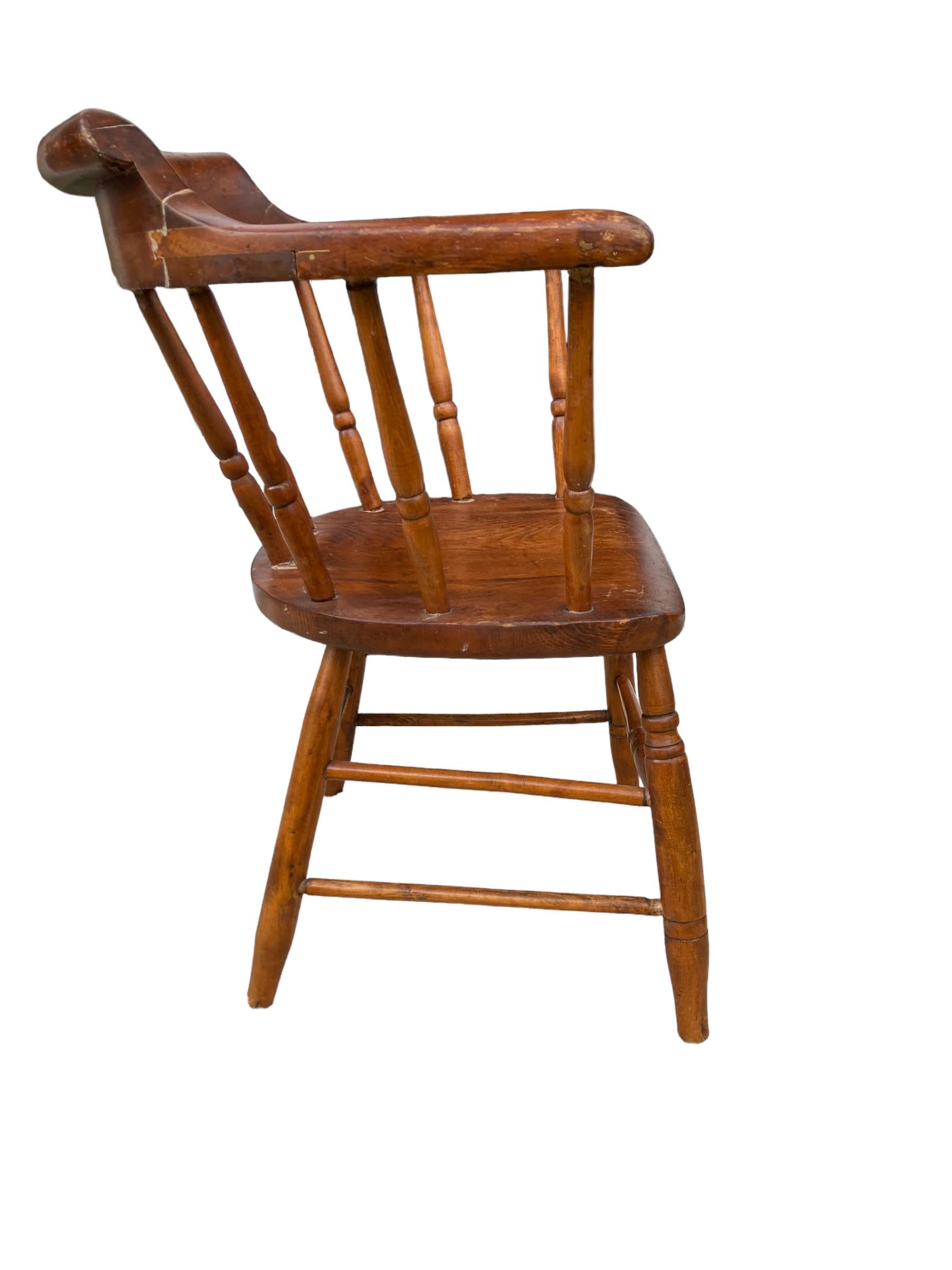 Antique Captains or Smokers Bow back armchair. Made from Beech and Elm this wonderful chair has all original legs and turned spindals with bow back rail. No creaks and charactistic colour and patina. Dated late 1800's. Original and functional