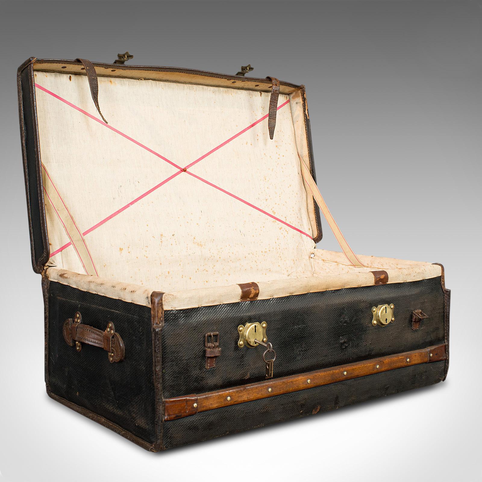 This is an antique captain's uniform travel case. An English, leather bound shipping suitcase, dating to the Victorian period circa 1890.

Attractive Victorian travel case
Displays a desirable aged patina
Canvas in consistent dark hues and good