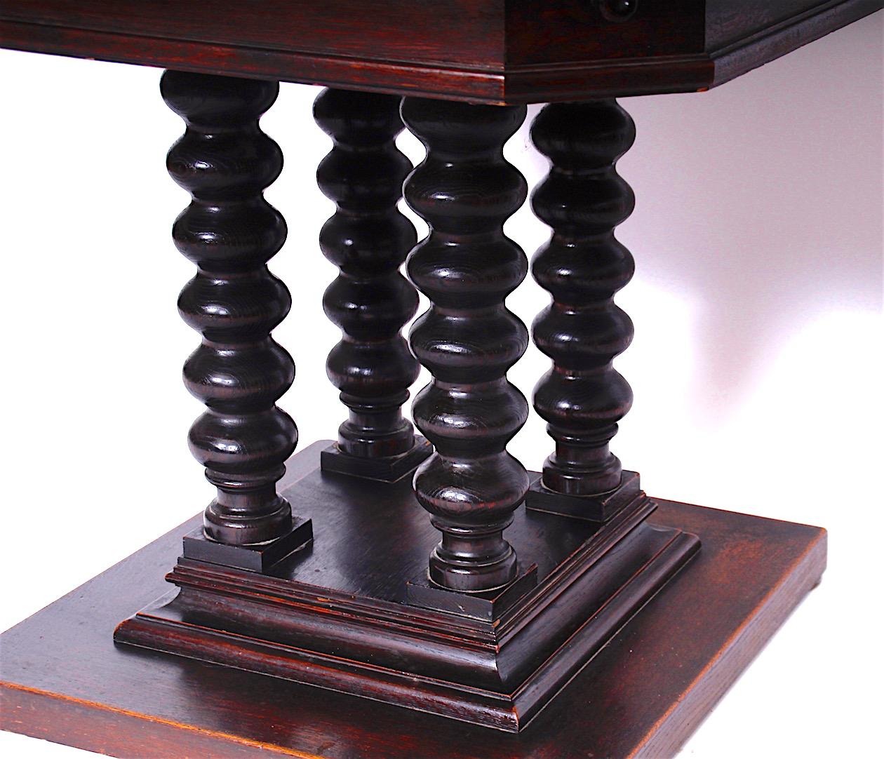 The card table from the period of historicism is in a nice original condition. The upper plate is covered with leather, drawers on each corner, beautiful carved base.