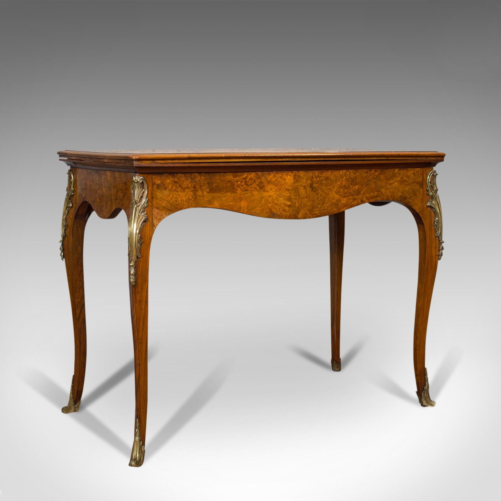 This is an antique card table. A French, burr walnut fold-over games table, dating to the Victorian period, circa 1870.

Highly appealing, rare antique gaming table
Displays a desirable aged patina
Exquisite burr walnut shows fine grain