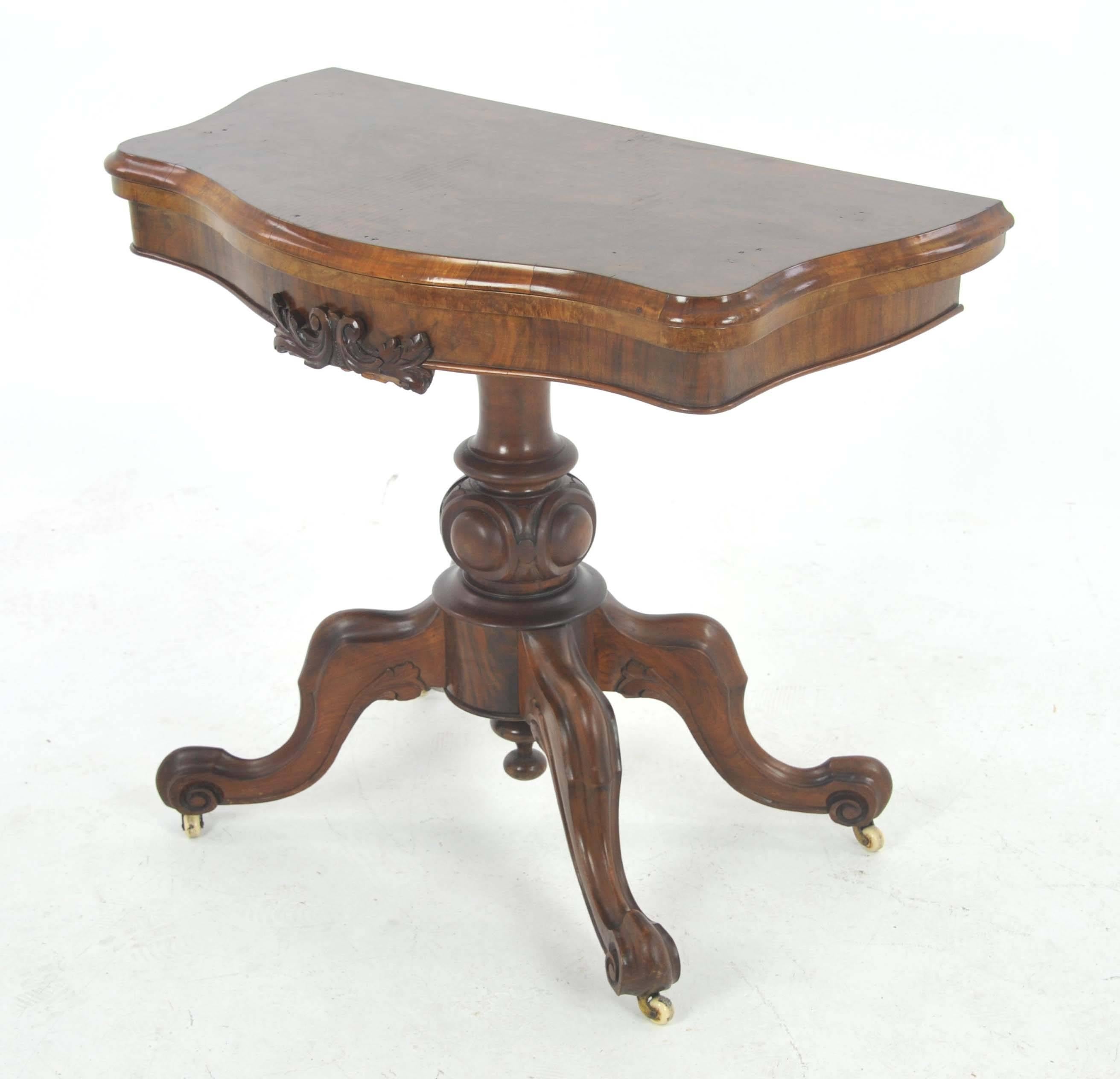 Antique card table, Victorian card table, walnut, Scotland, 1870.

Scotland, 1870
Solid walnut and veneers
Original finish
Serpentine shaped top with carved frieze
Swivel top opens to double size to reveal a green velvet top
Standing on a shaped