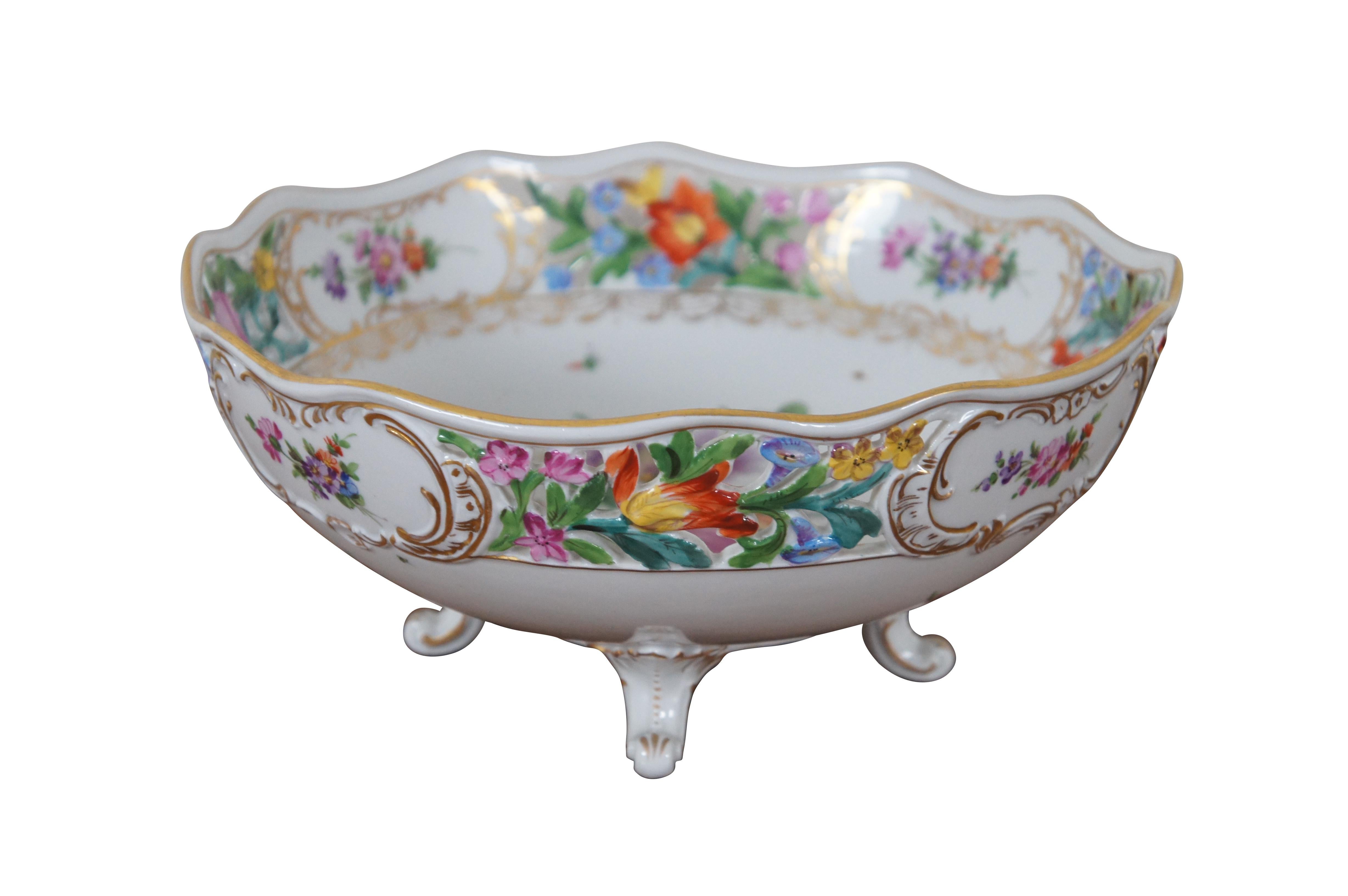 Antique Carl Thieme Dresden porcelain centerpiece bowl, basket or compote featuring round scalloped form with reticulated floral design and footed base.

“The Sächsische Porzellan-Manufaktur Dresden GmbH (Saxon Porcelain Manufactory in Dresden Ltd),