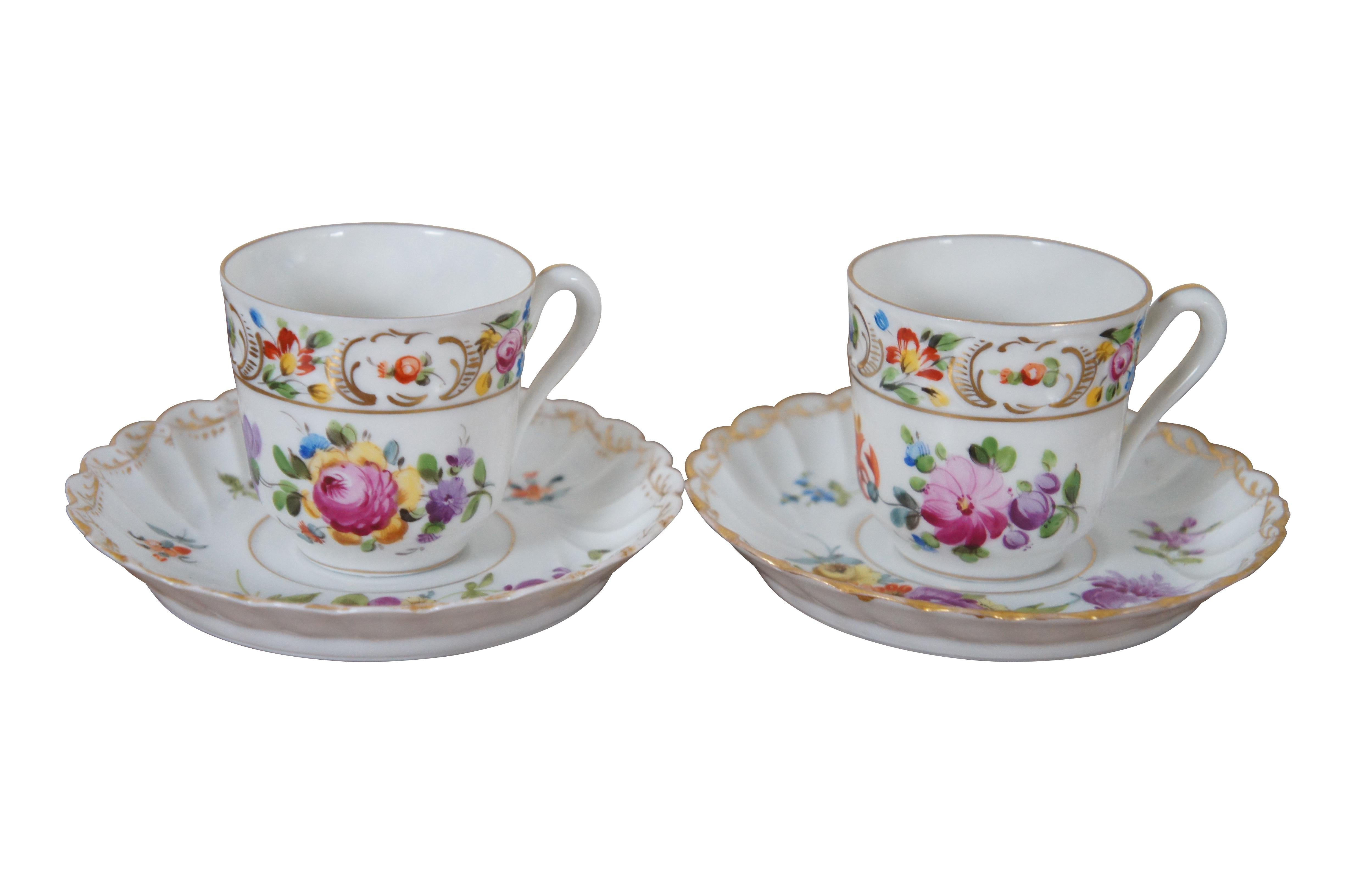 Antique four piece Carl Thieme German Dresden porcelain demitasse teacup / tea / coffee cups and saucers featuring floral design with gold accents.

Dimensions:
4.5” x 2.5” (Diameter x Height)