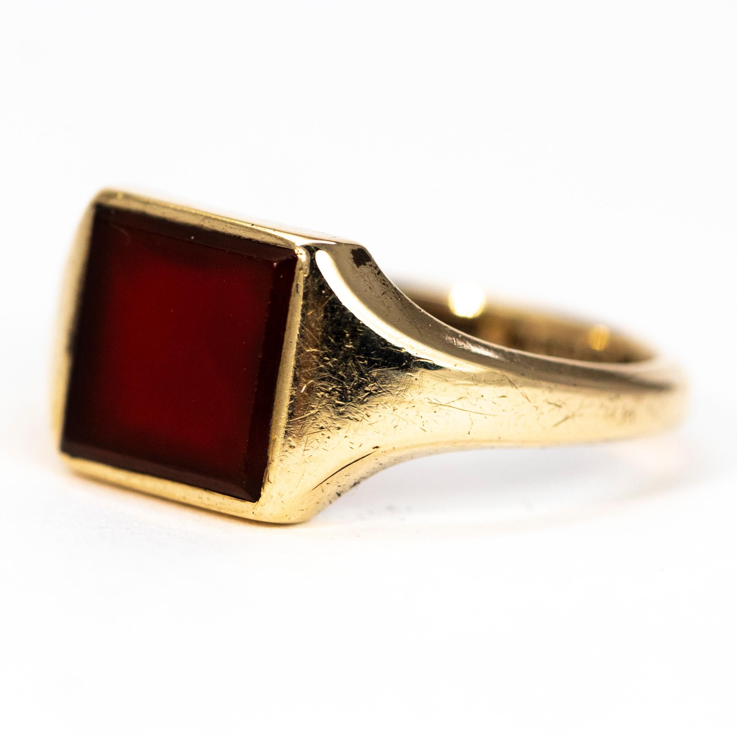 The carnelian stone in this signet ring is a deep rich brown colour that sits flush within the 9carat gold ring. Made in Birmingham, England.

Ring Size: R or 8 3/4
Stone Dimensions: 8.5 x 8.5mm 

Weight: 4.4g