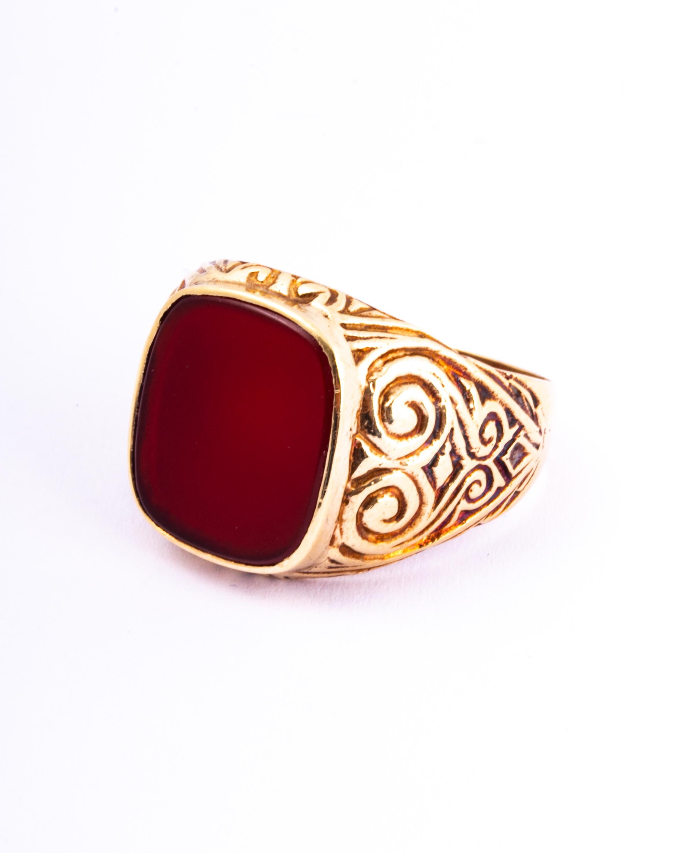 The shoulders on this are to die for and the shape of the stone stunning! The carnelian is a deep red/brown colour and is encased in a 9ct gold setting upon beautiful detailed shoulders. Made in Birmingham, England.

Ring Size: M 1/2 or 6 1/2
Stone