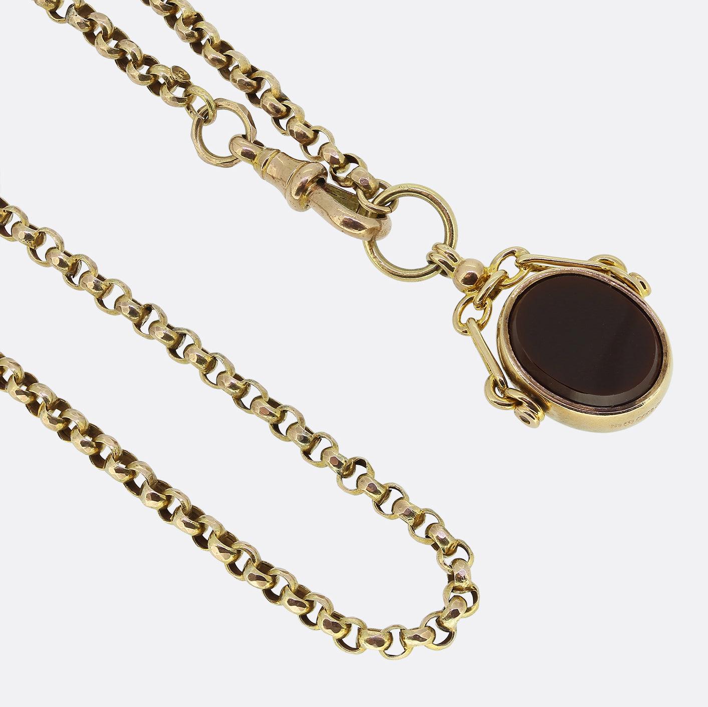 Here we have a chic and stylish necklace dating back to the early stages of the 20th century. The pendant has been crafted from 9ct yellow gold into the shape of a spinning fob which has been set on one side with an oval shaped rich red carnelian