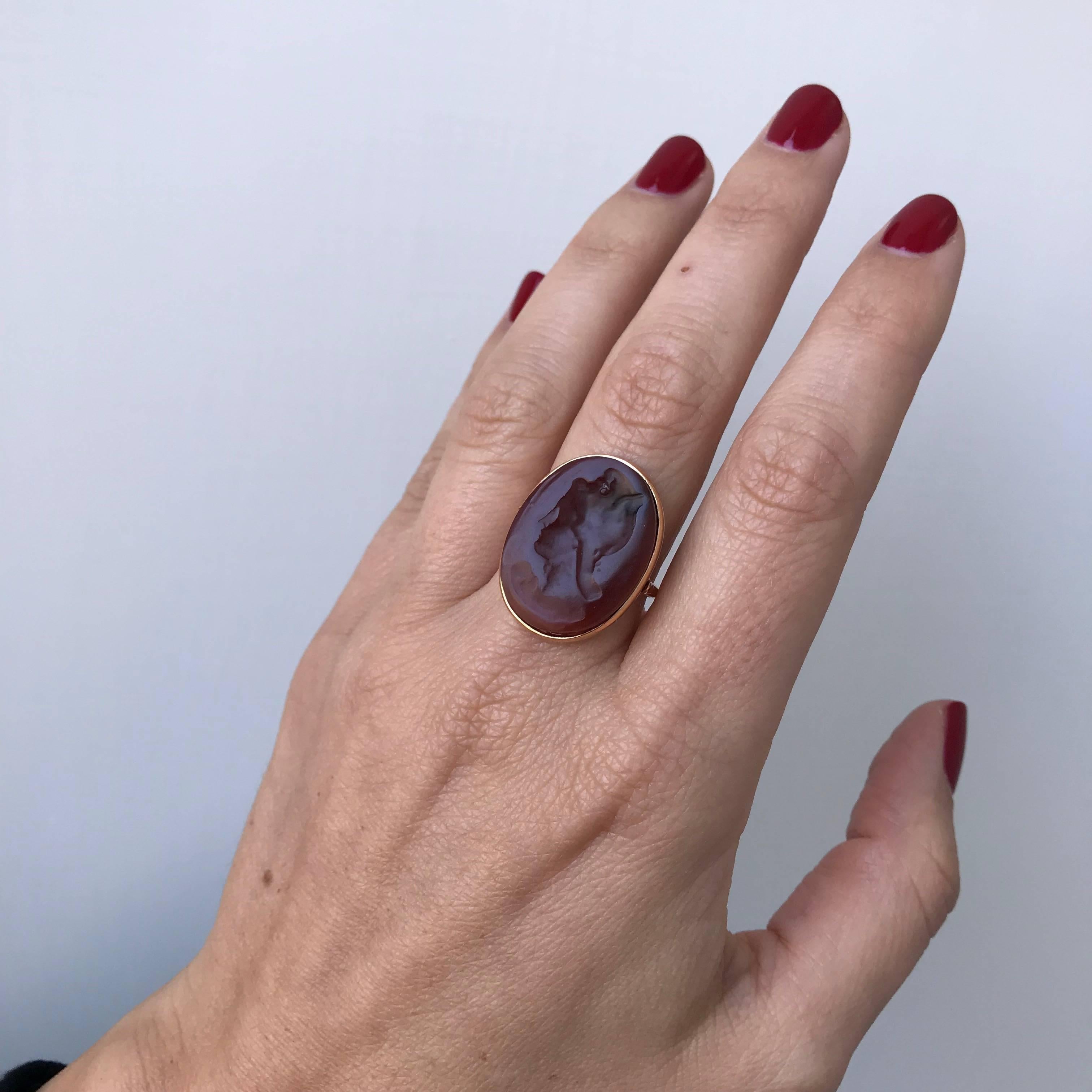 Beautiful Ring mounted in 9k Rose Gold, marked 385. 
The Ring features an old hand carved carnelian depicting the face of a woman.

CONDITION: Excellent 
METAL: 9k Rose Gold 
GEM STONE: Carnelian
DESIGN ERA: 1920
WEIGHT: 6 grams
RING SIZE: US 7/7.5