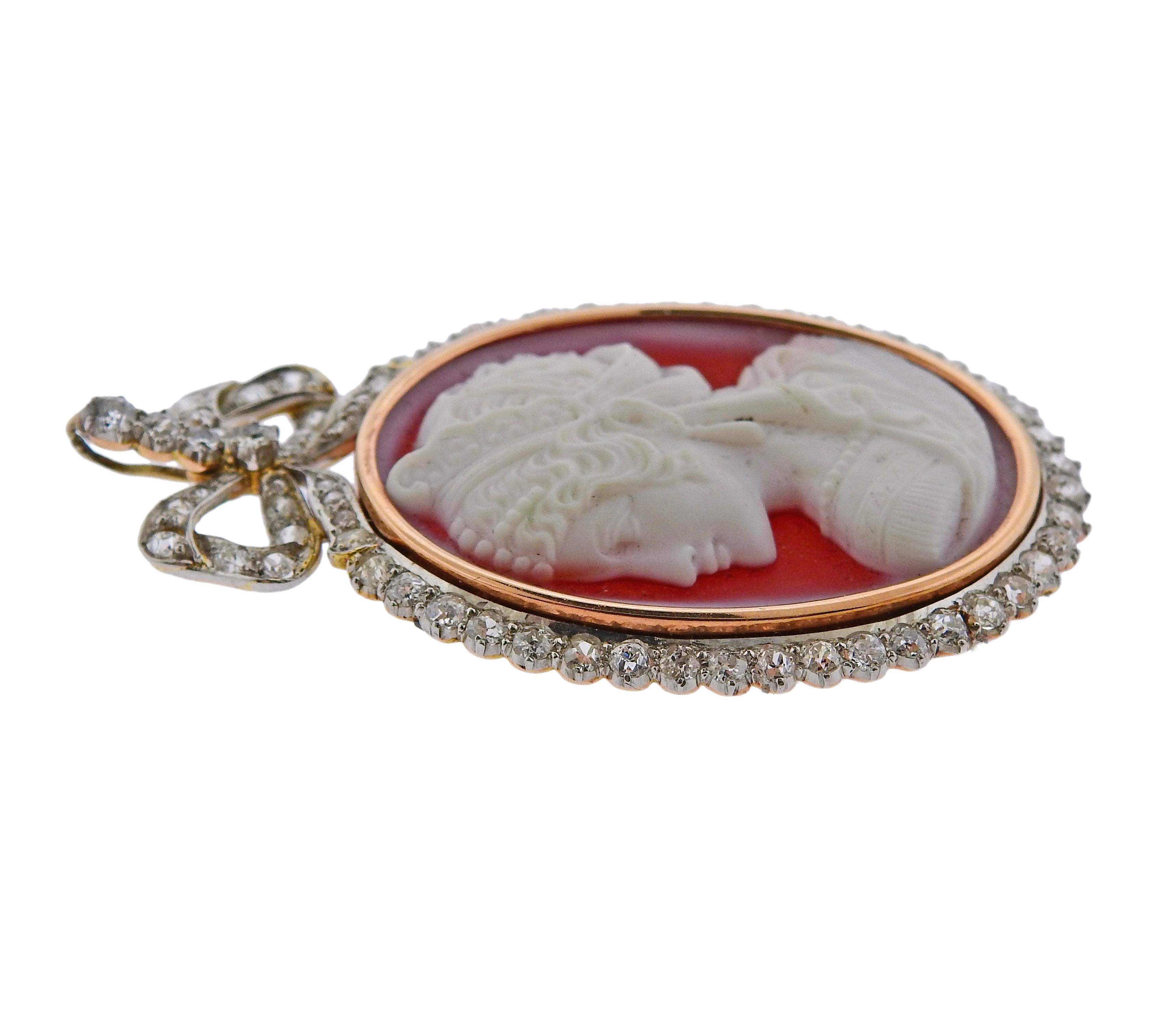 Antique 14k gold cameo brooch pendant, set with carnelian and approx. 1.40ctw in diamonds. Measures 57mm x 35mm. Back of the carnelian is signed with a name (illegible to read).  Weighs 17 grams.

SKU#PD-00163