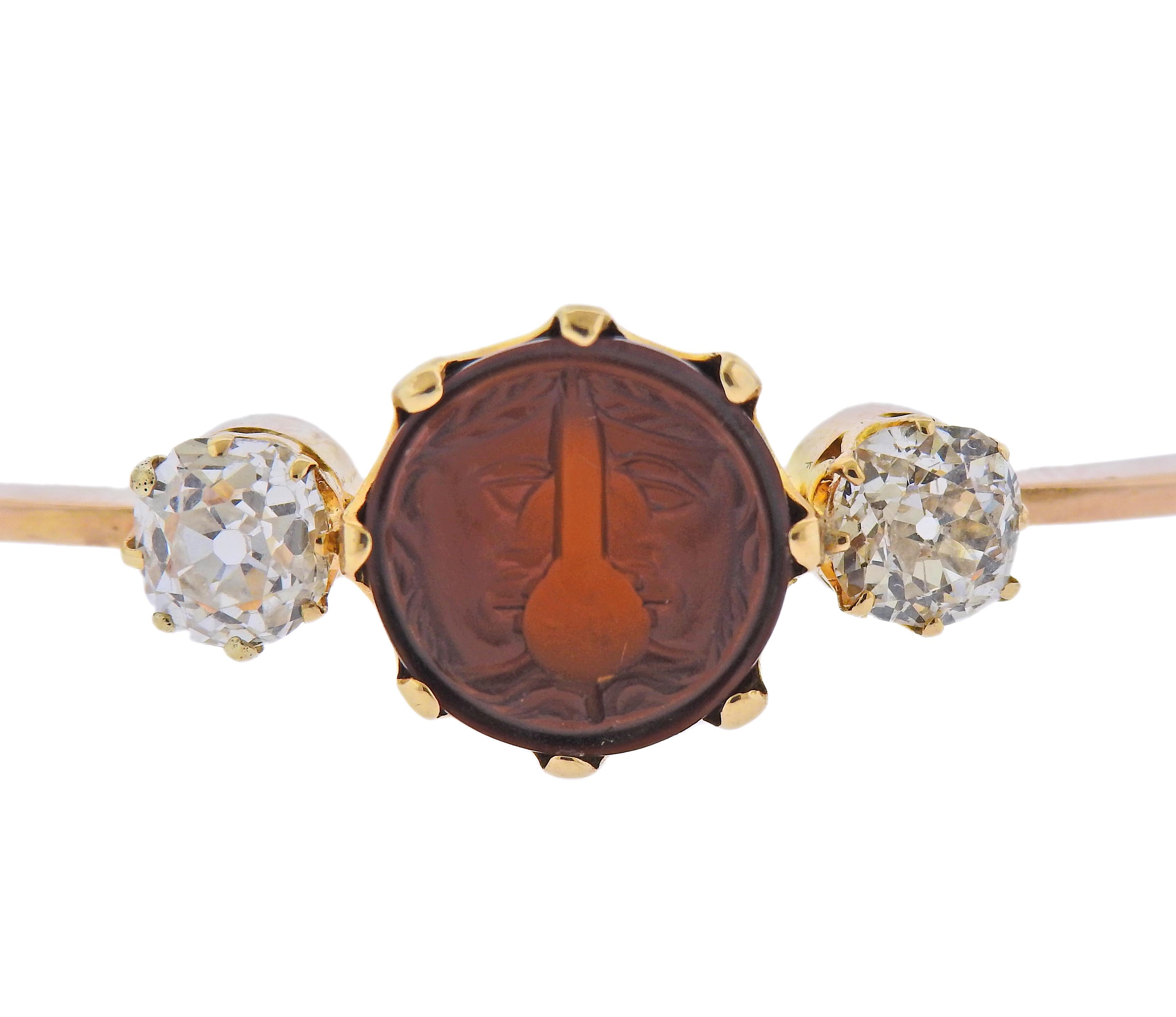 Antique 18k gold bangle bracelet, with one center carnelian intaglio, set with two side old mine cut diamonds - approx. 0.75-0.80ct each. Bracelet will fit approx. 7