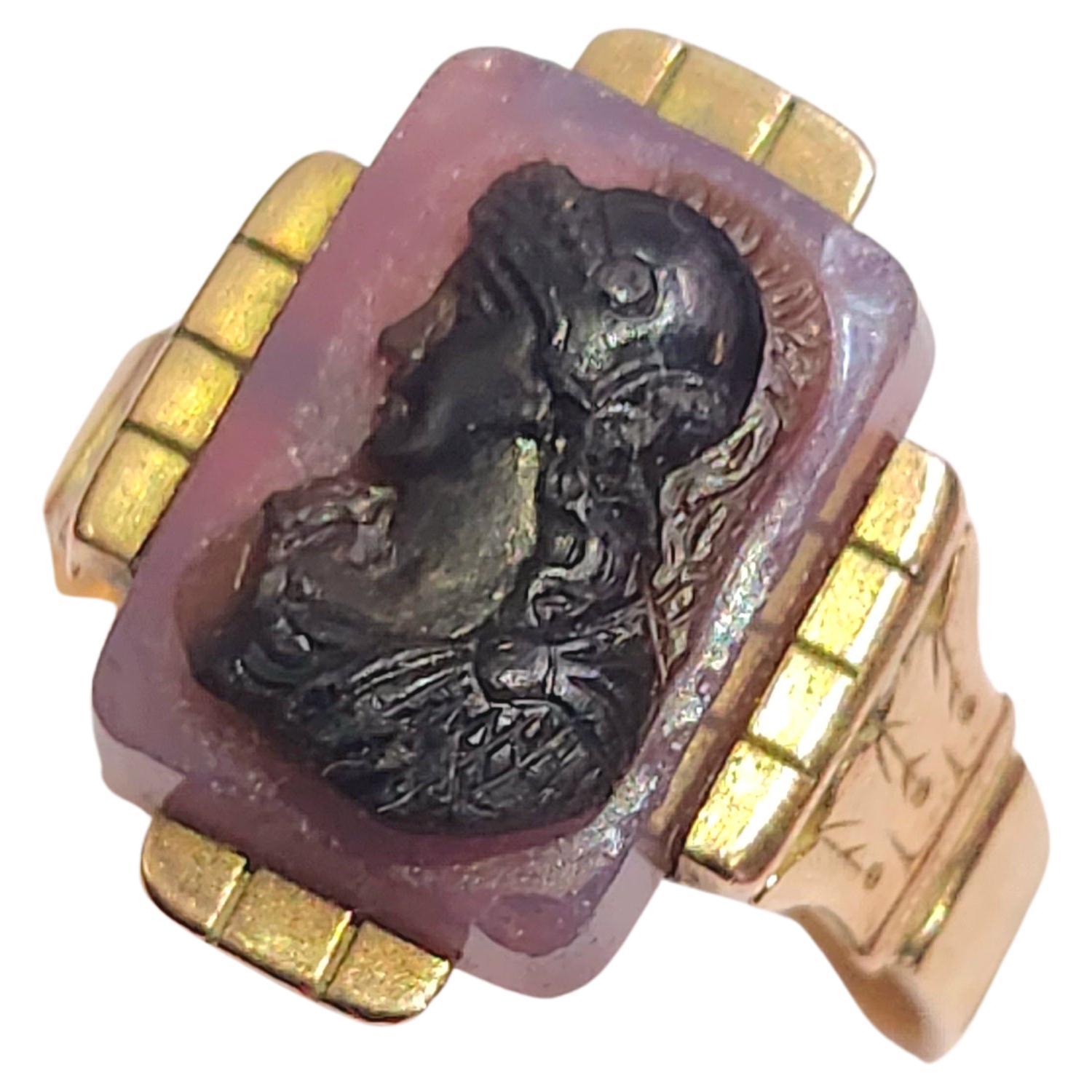 Antique 1850s carnelian and onyx cameo ring of a womans profile in 14k gold ring setting with detailed work on sides