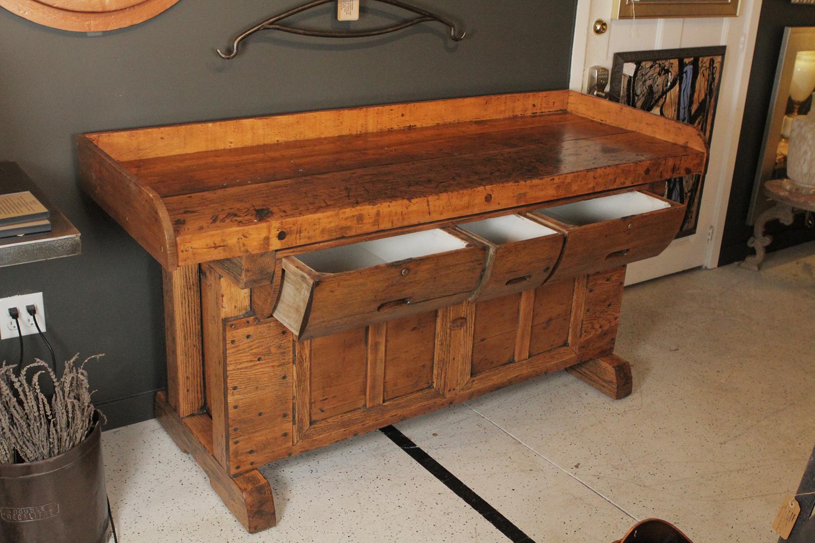 Antique carpenters work bench with drawers and cabinet storage expertly refinished with a mellow waxed finish. Dimensions 65” L x 25” D x 32” H.