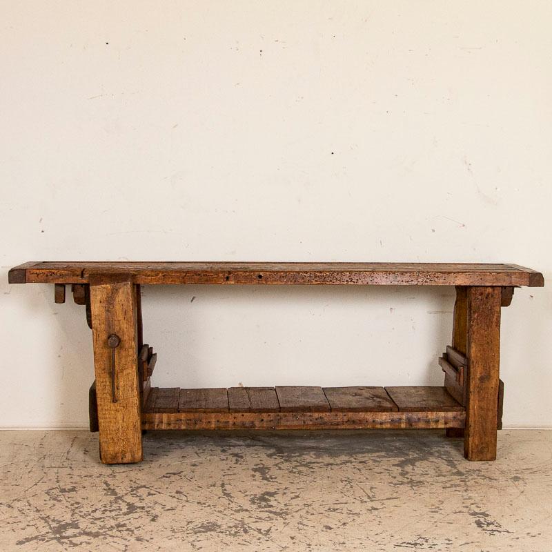 It is the years of constant use revealed in every ding, gouge, stain, paint spill and scratch that enrich the character of this impressive carpenters' workbench from France. Please examine the close up photos to appreciate the dark patina, joints