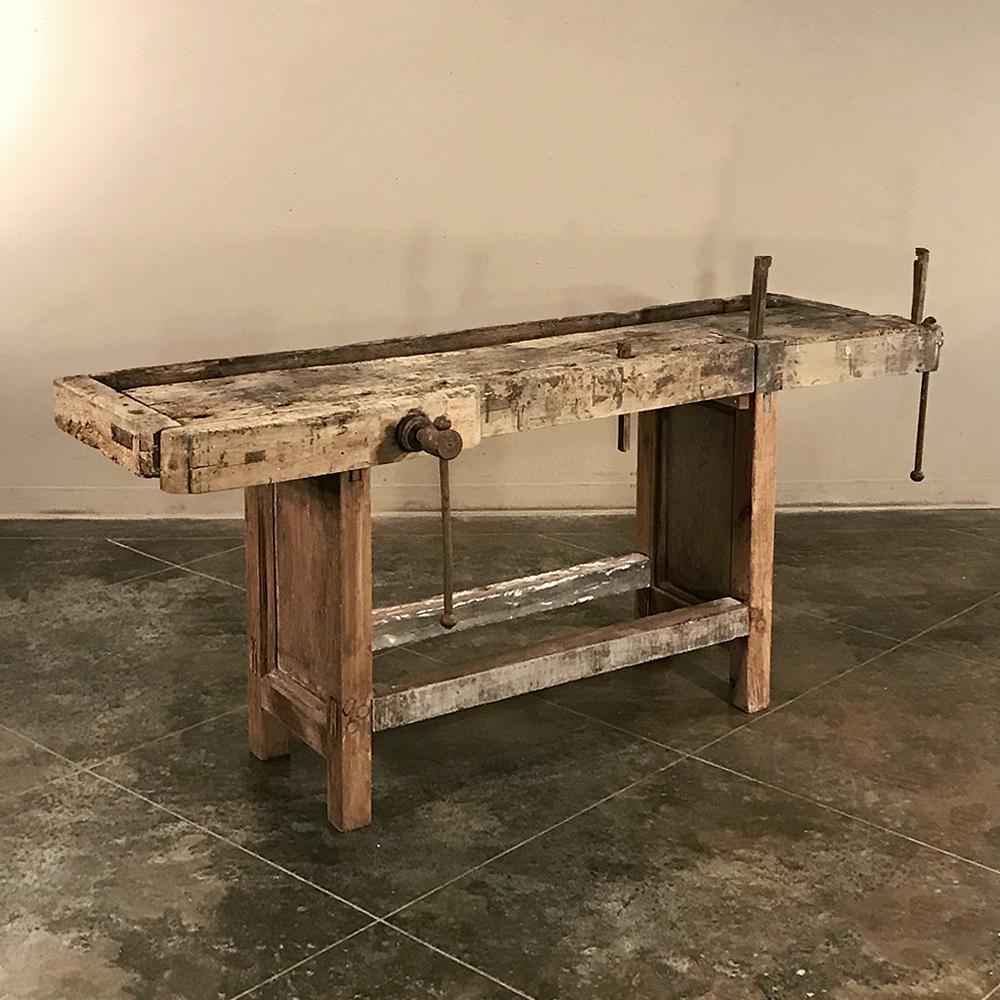 Antique carpenter's workbench ~ sofa table ~ console is intriguing, because it's entirely possible that some of the furniture in our showrooms was created on this very bench! Hand-hewn from solid oak timbers and fitted with two sturdy iron-screwed