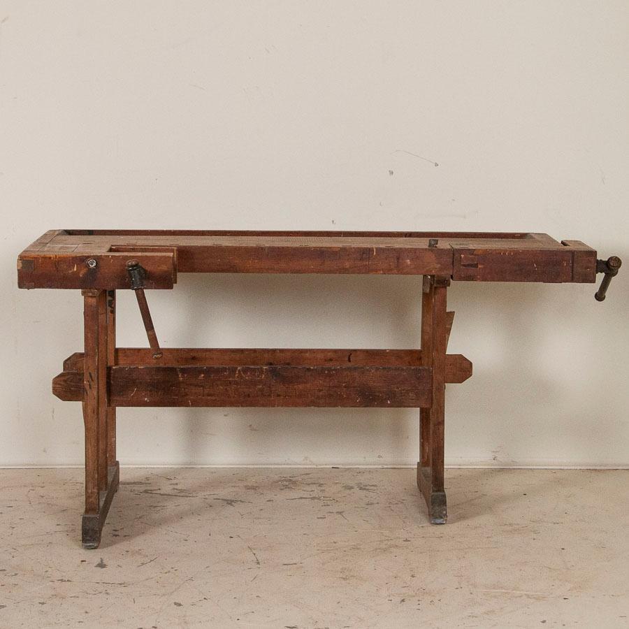 Wonderful old antique Danish carpenters' workbench, bearing an incredible patina after years of traditional use. The scratches, dings and even spilled paint only add to the vintage character of the work table. Please examine the close up photos to