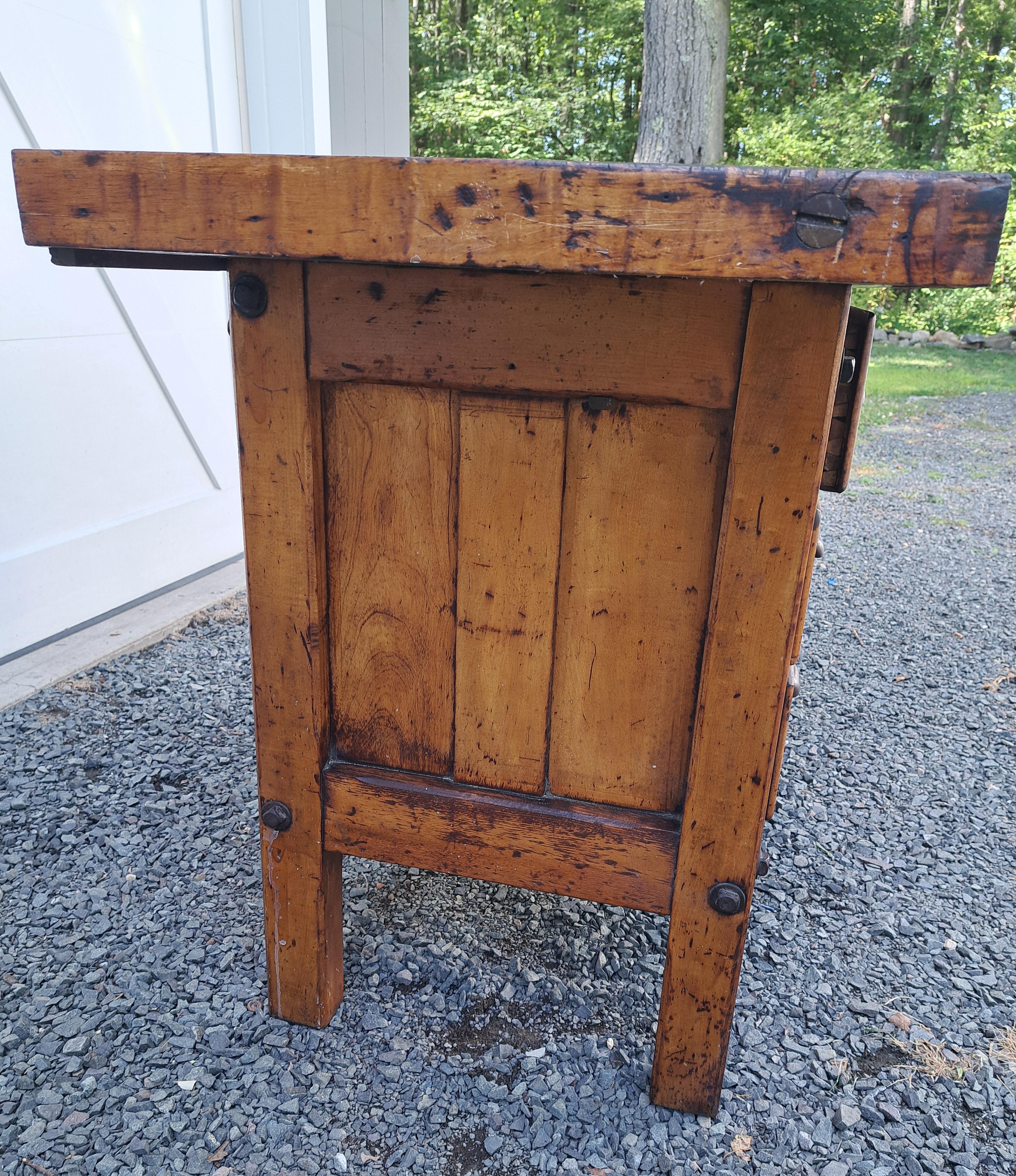 Antique Industrial Carpenters Workbench having 5 drawer cabinet.  It is 51.5