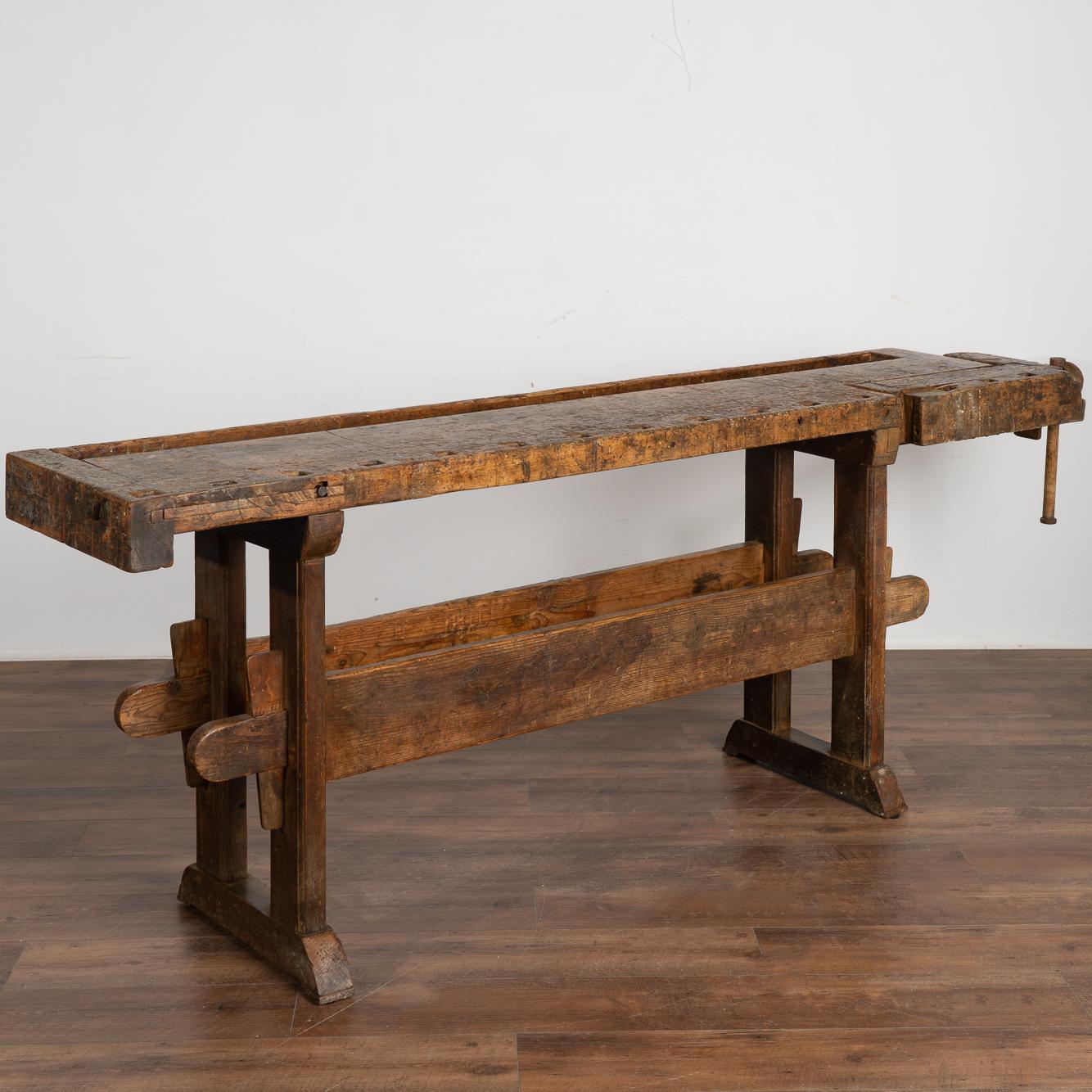 It is the years of constant use revealed in every ding, gouge, stain and scratch that enrich the character of this carpenters' workbench from Denmark.
Please examine the close up photos to appreciate the dark patina, joints and old hardware.
It