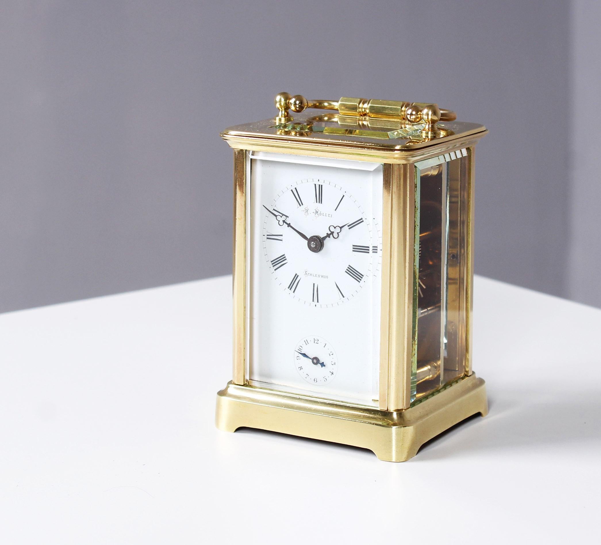 Signed travel alarm clock, carriage clock

France
Brass, enamel,
circa 1900

Dimensions: H x W x D: 11.5 x 8 x 6.5 cm


Travel alarm clock in brass case glazed on all sides.
Enamel dial with roman numerals and dealer signature: H. Möller