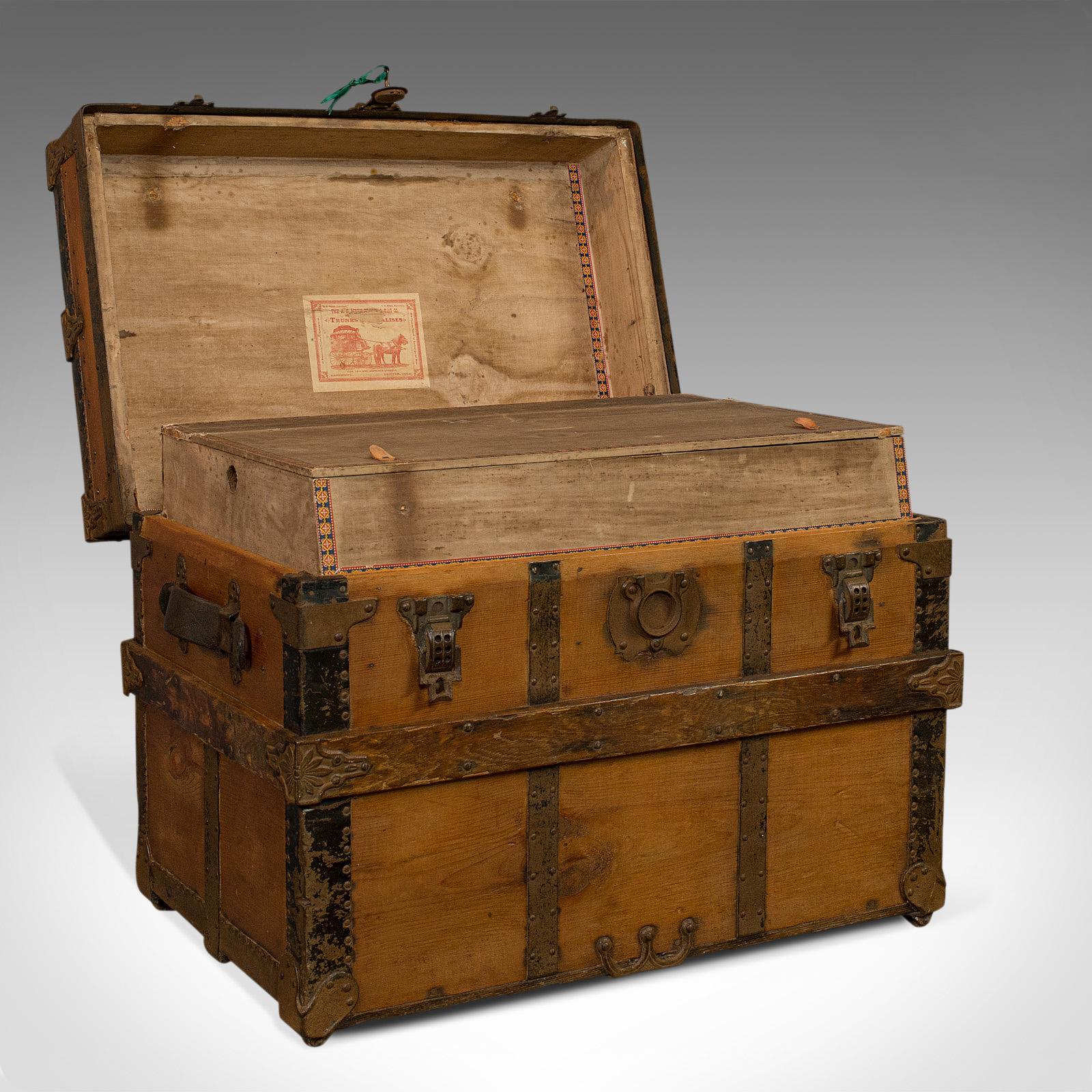 This is an antique carriage trunk. An American, spruce chest by A.E. Meek of Colorado and dating to the late 19th century, circa 1890.

Period Western appeal with bountiful charm
Displays a desirable aged patina and original order
Stocks of