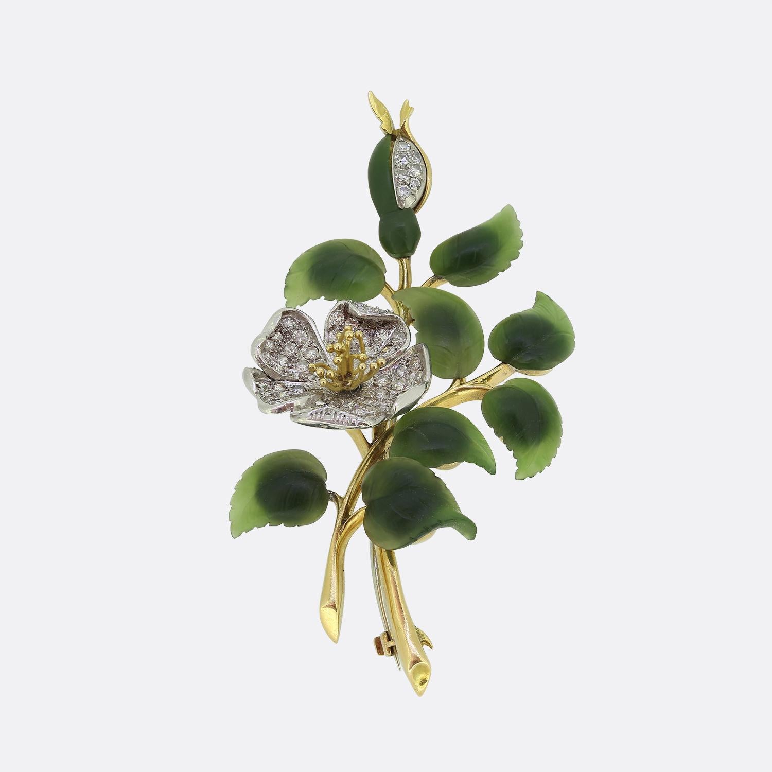 Here we have a wonderful brooch dating back to the early 20th century. The brooch features carved nephrite jade leaves and a pave set diamond flower. The brooch has been exceptionally made in platinum and 18ct yellow gold.

Condition: Used (Very