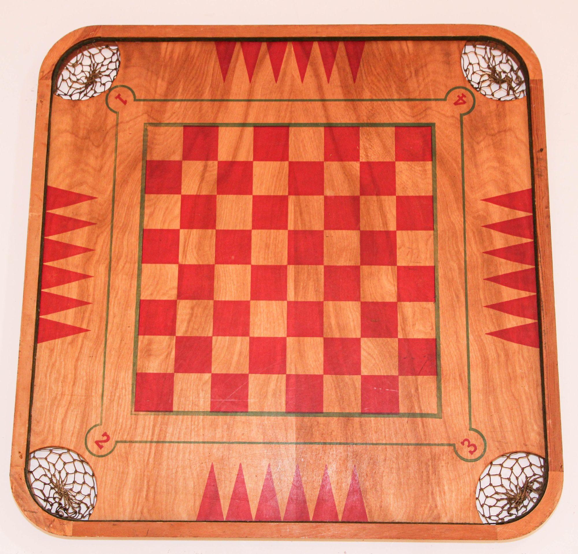 Antique carrom large wooden game board double-sided.
Antique Carrom Company 1907 wood game board double sided, made in USA.
Each corner of the board contains a rope-strung pocket.
This game board with multi surface combination board was