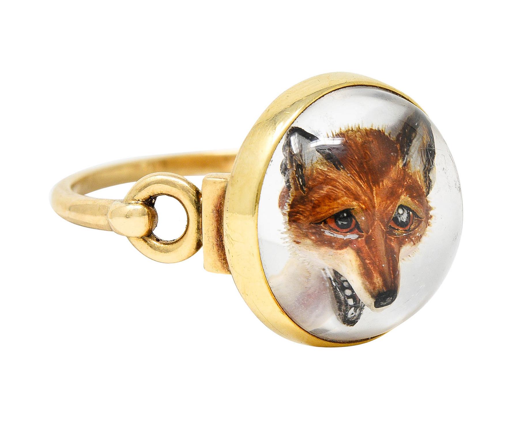 Featuring a 13.5 mm round and domed rock crystal quartz cabochon

Reverse carved to depict a dimensional rendering of a fox - hand painted in high detail

And backed by white mother-of-pearl with moderate but broad iridescent sheen

Bezel set and