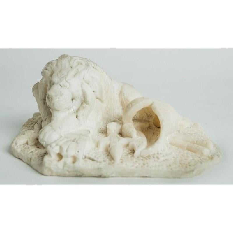 Unique carved alabaster press papier in the shape of a lion. Likely made by a French soldier after defeating the German army in 1871. A charming desk accessory.