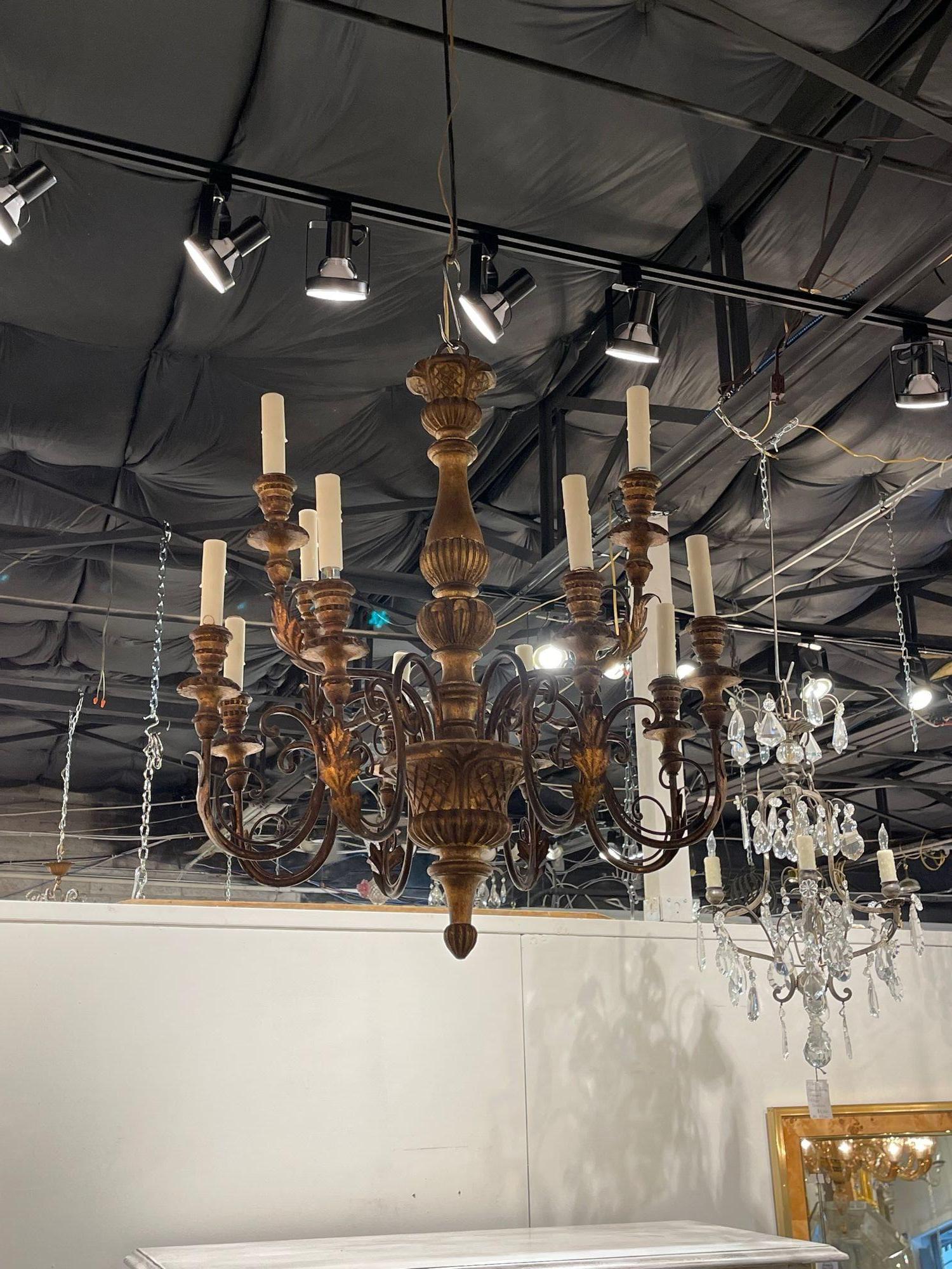 Lovely antique carved and giltwood Italian chandelier. Featuring very nice carvings along with 2 tiers of lights. Gorgeous!!