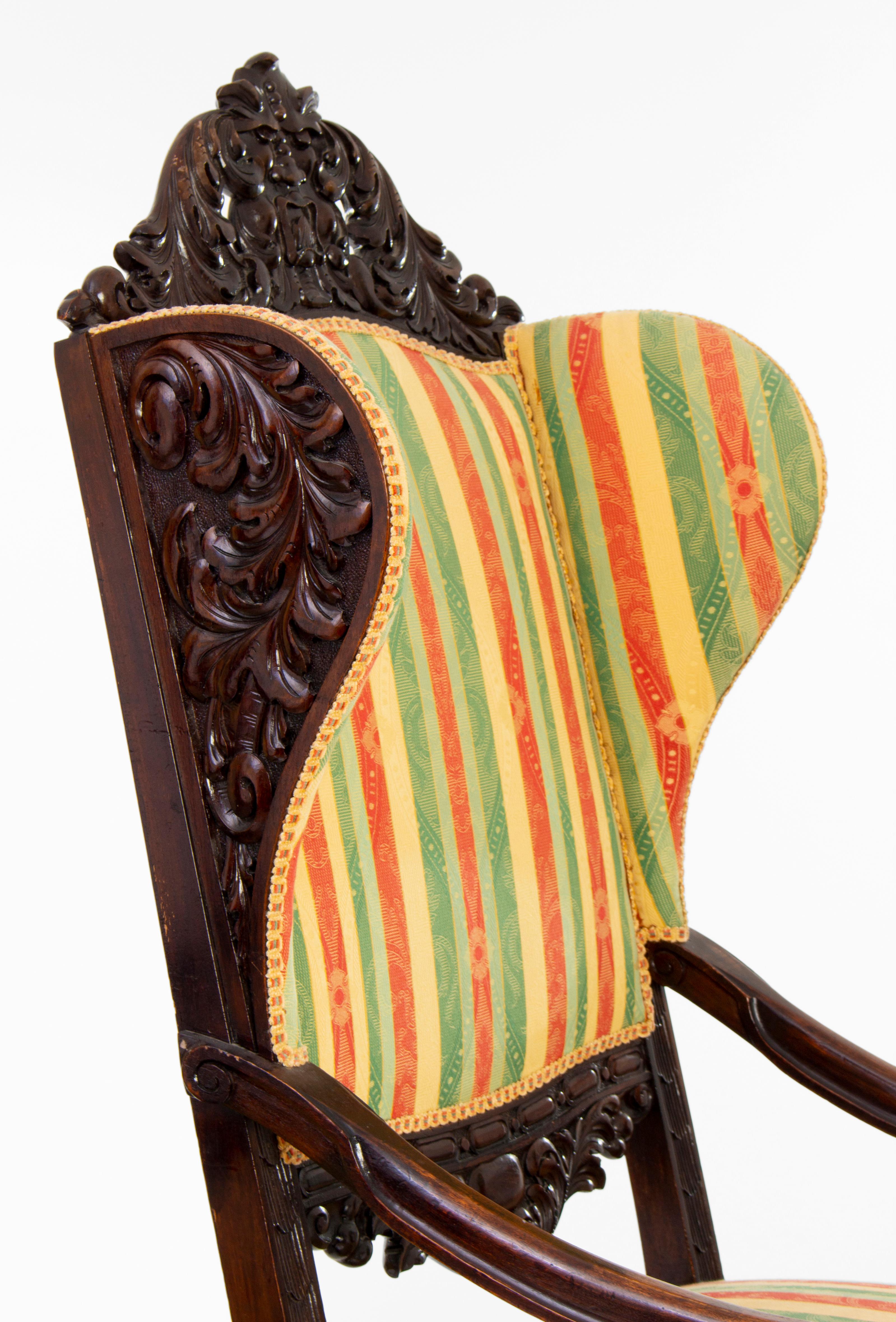 Antique carved basswood wingback chairs in historicist, eclectic style.
The thronechairs are in good condition, with beautiful coloured upholstery.
The set consists of 2 pieces.