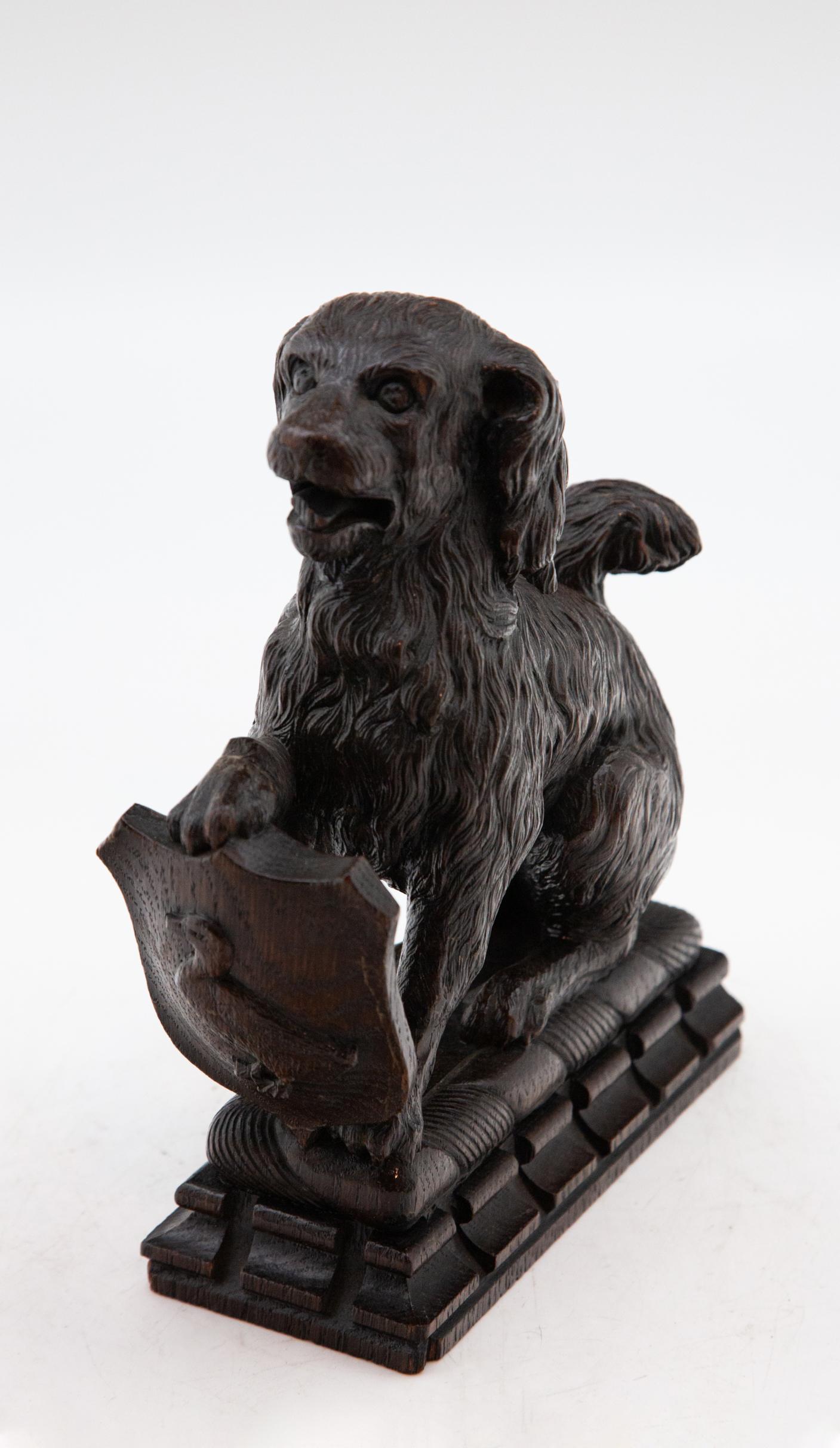 20th Century Antique Carved Black Forest Dog Holding Duck Crest
