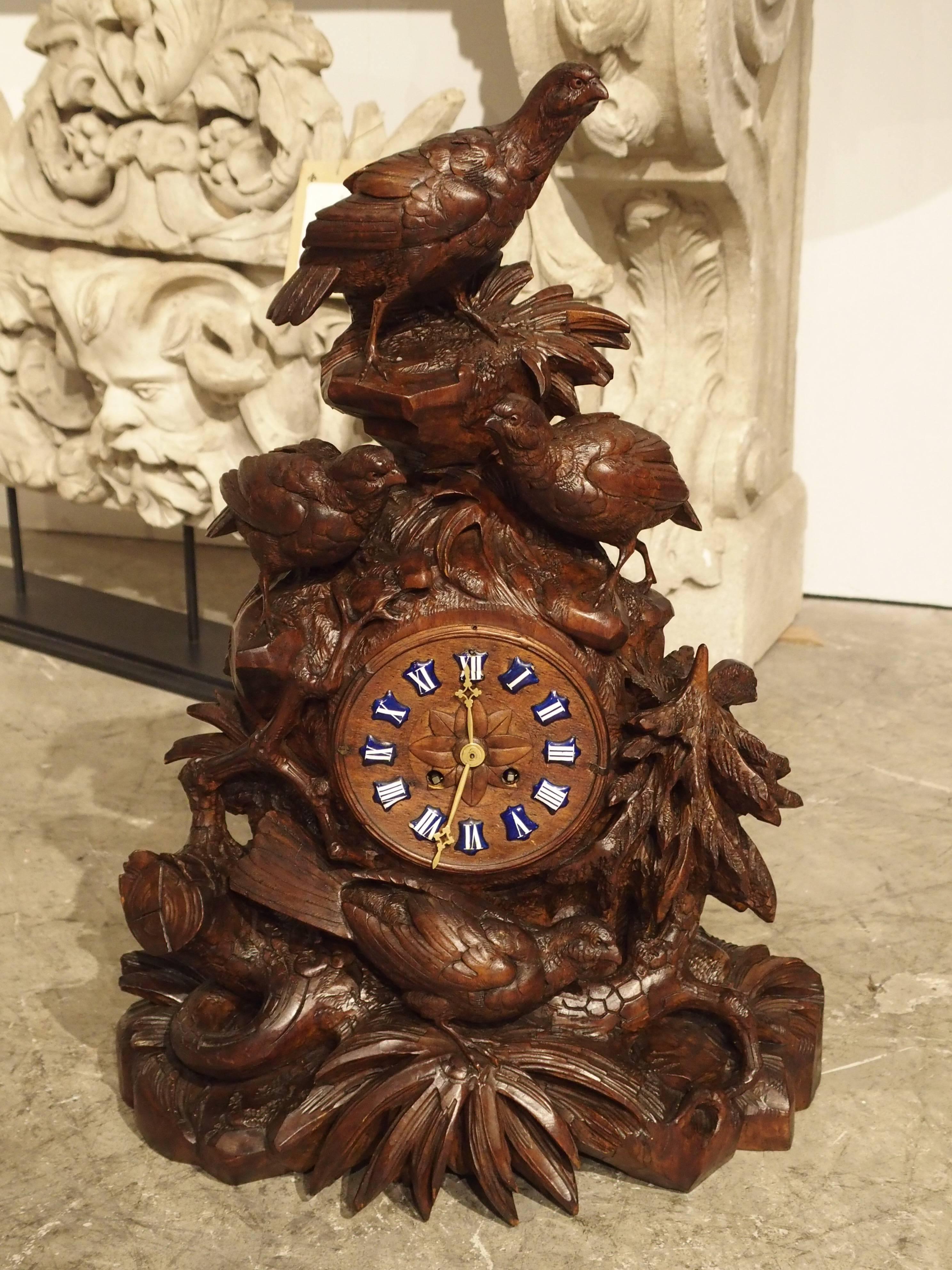 This wonderful hand-carved Black Forest mantel clock depicts four birds at varying levels on branches and leaves. It dates to circa 1880s, which puts it right in the period when Black Forest carvings were gaining popularity in Europe.

The