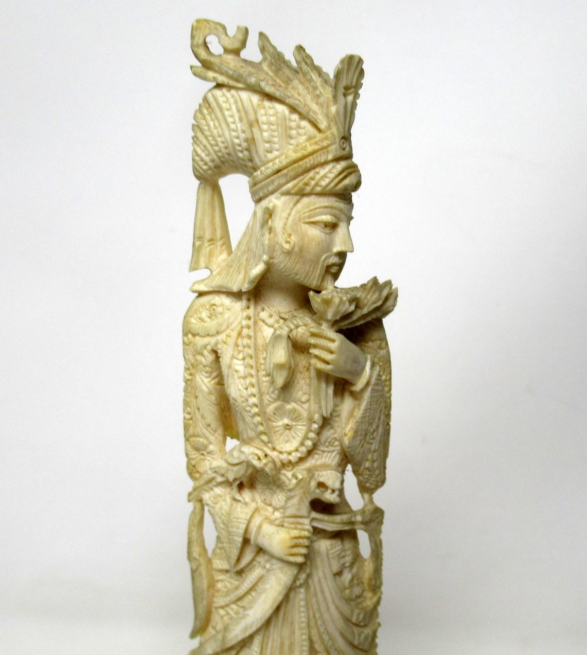 An exquisitely hand carved bone Chinese dignitary standing figure portraying a lavishly dressed bearded male.

Difficult to date, in our opinion last quarter of the 19th century.

Characterized by beautiful carved decorations, numerous details.